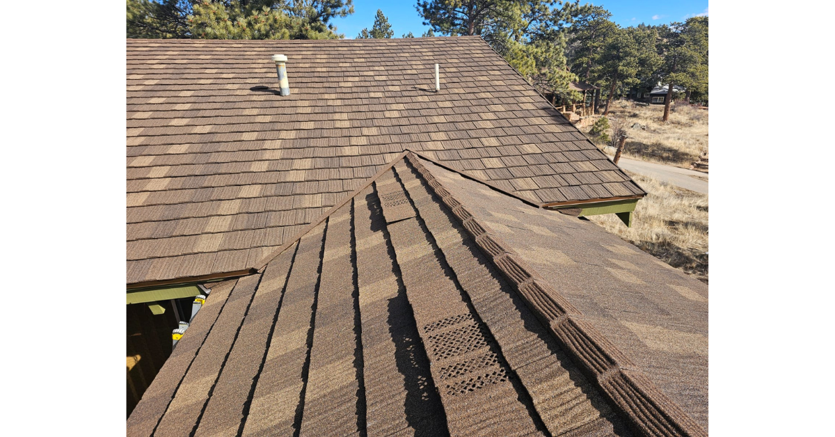 Roof repair replacing damaged shingles on residential home.