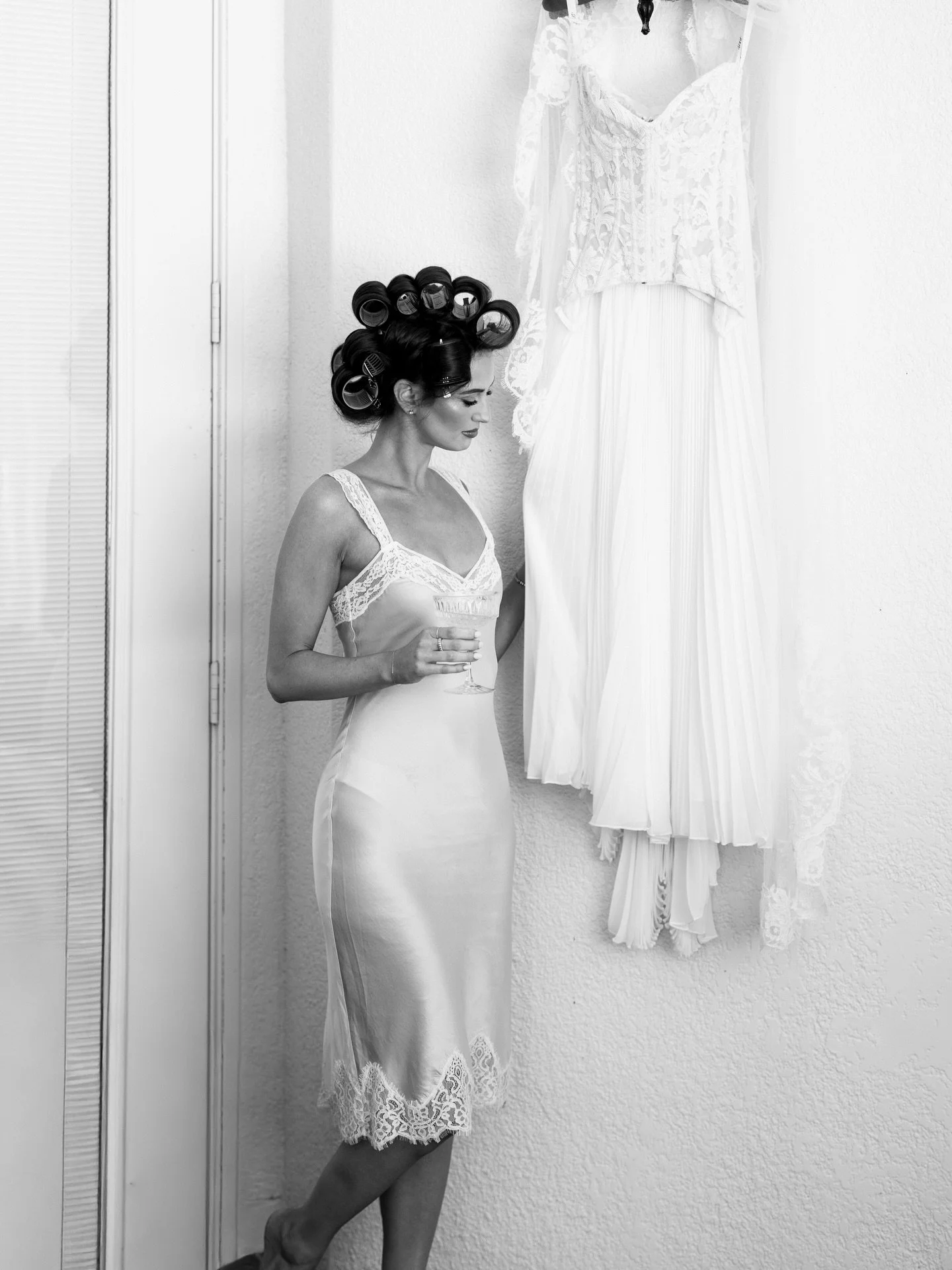 Angelina in curlers with champagne
Before slipping into her @septnewyork 

Bride @angelinaferrara 
Gown @septnewyork 
Florals @revelationfloral 
Venue @lacasatoscana