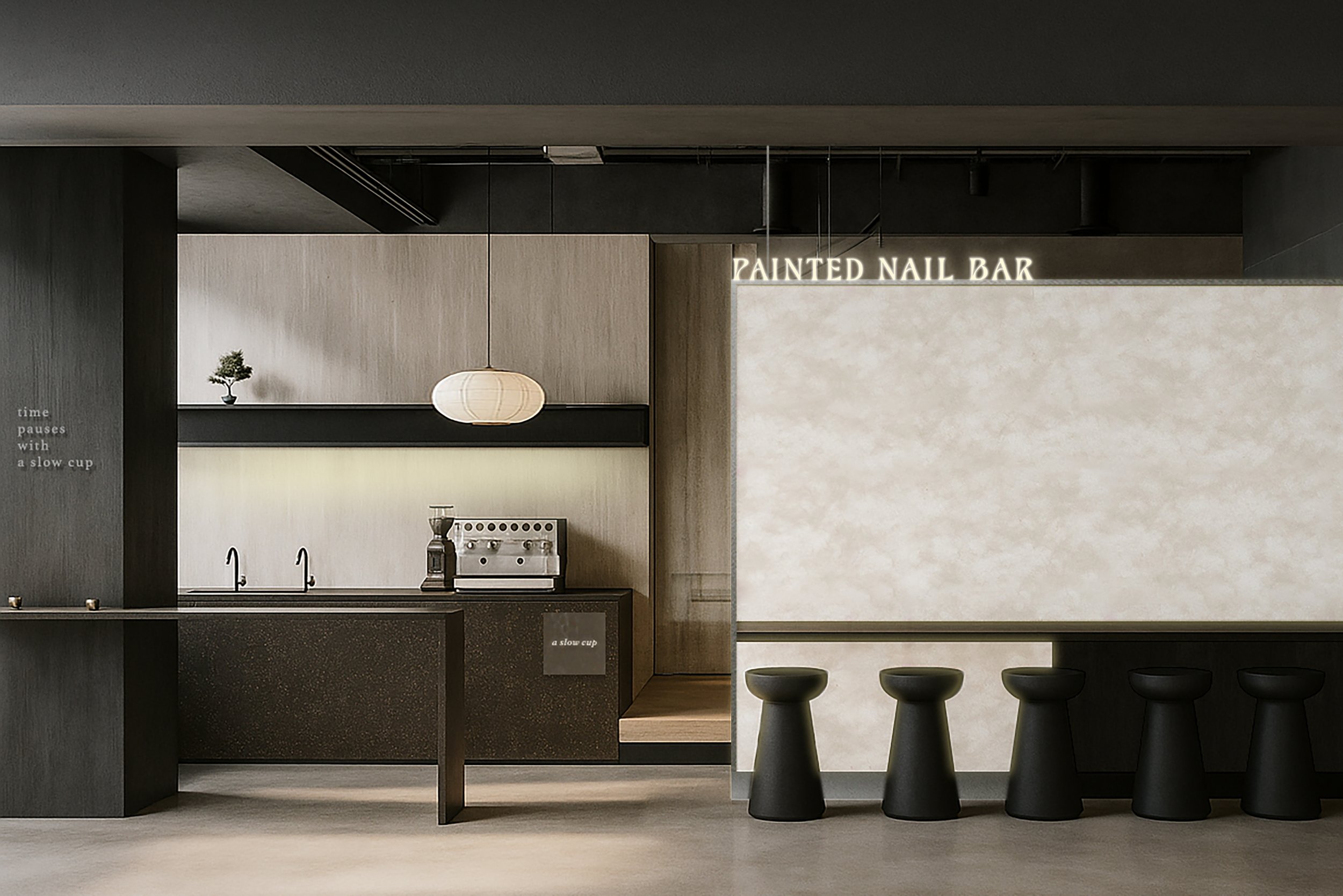 Interior of a minimalist coffee shop with a black counter, bar stools, and a sign that says 'Painted Nail Bar' in the background.