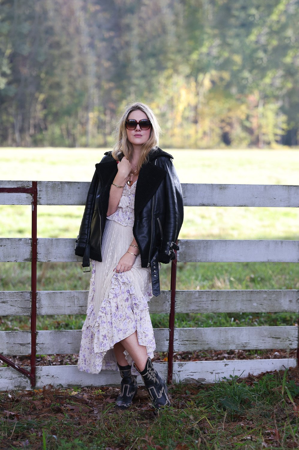 Female artist, Elizabeth Crane Schwartz, jewelry designer portrait with short red hair and a color necklace showcasing her work.