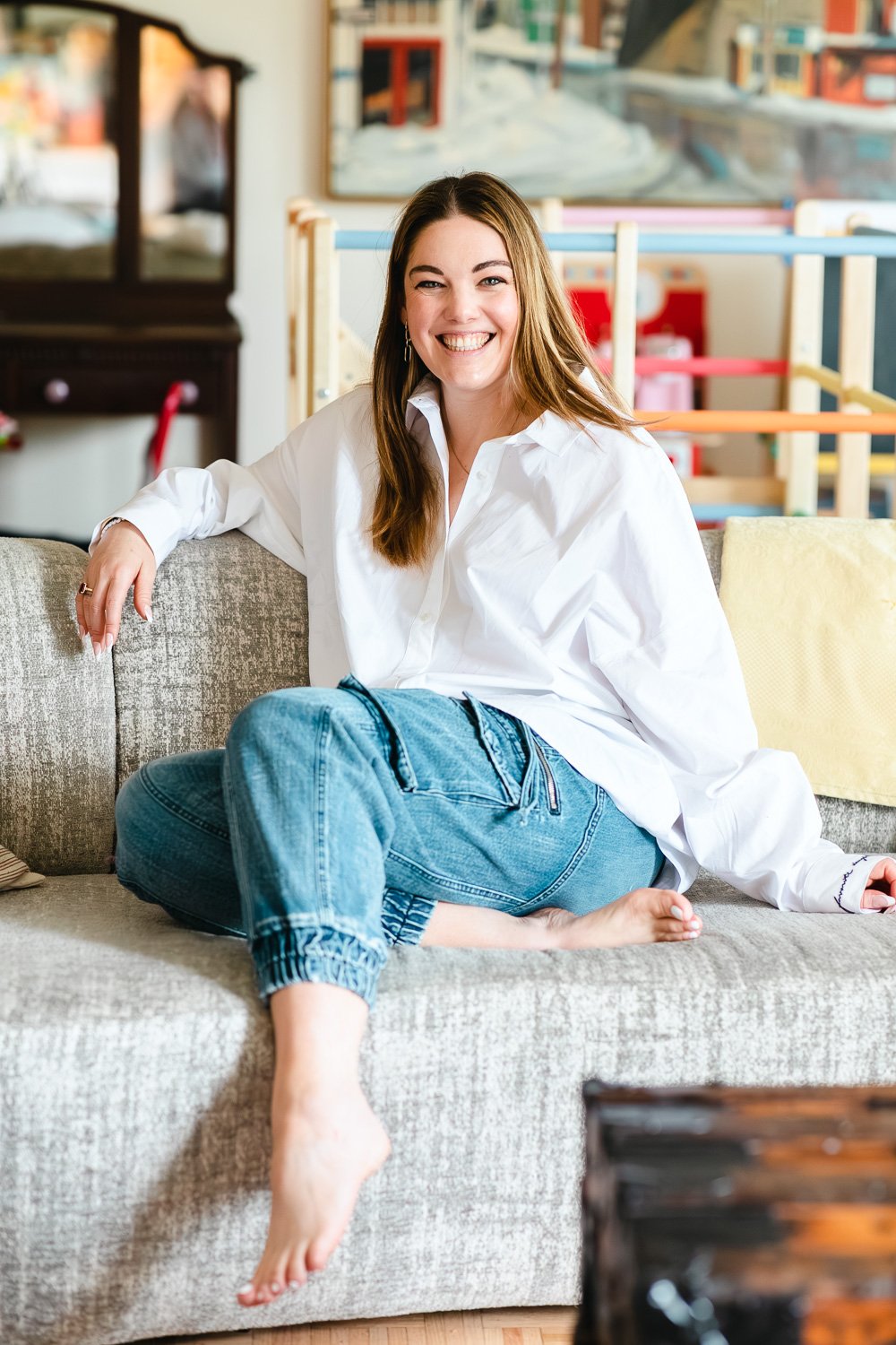 woman-lauging-on-couch-at-home.jpg