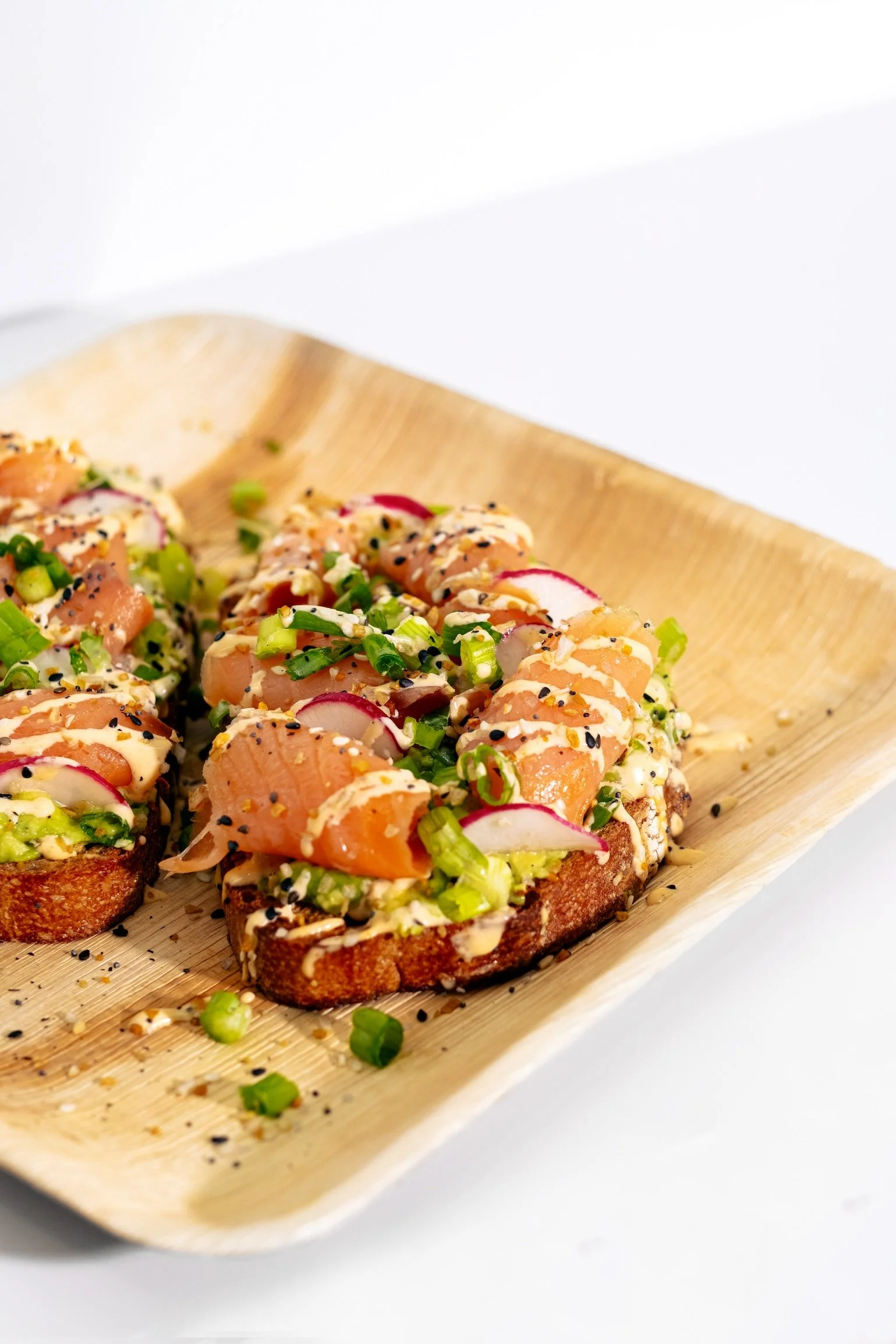 Smoked salmon avocado toast with radish and green onions
