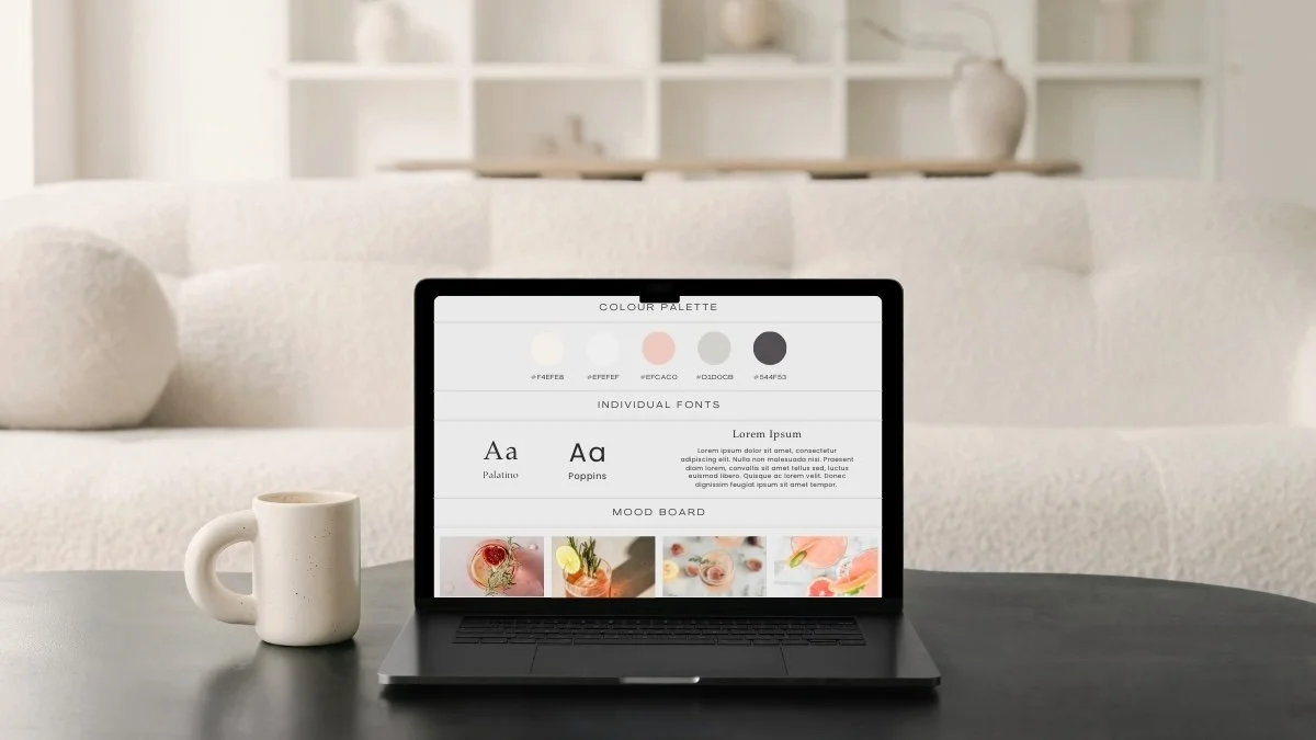 black laptop on a black desk with a cup