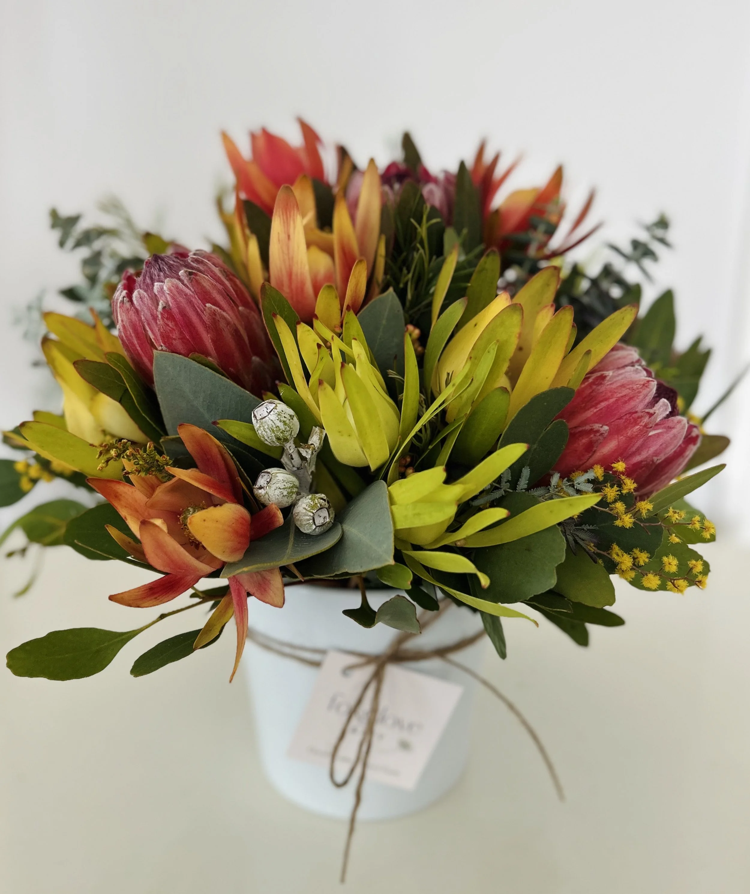 Wildflower ceramic pot showcasing Proteas, leucodendrons and eucalyptus grown on our flower farm in Bacchus Marsh