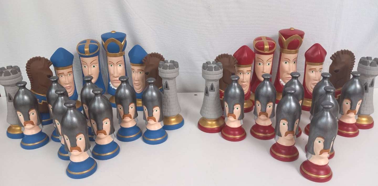 Vintage medieval chess set complete with red and blue, the king standing 8" in height. In excellent condition, and perfect for your favorite chess player... or yourself.