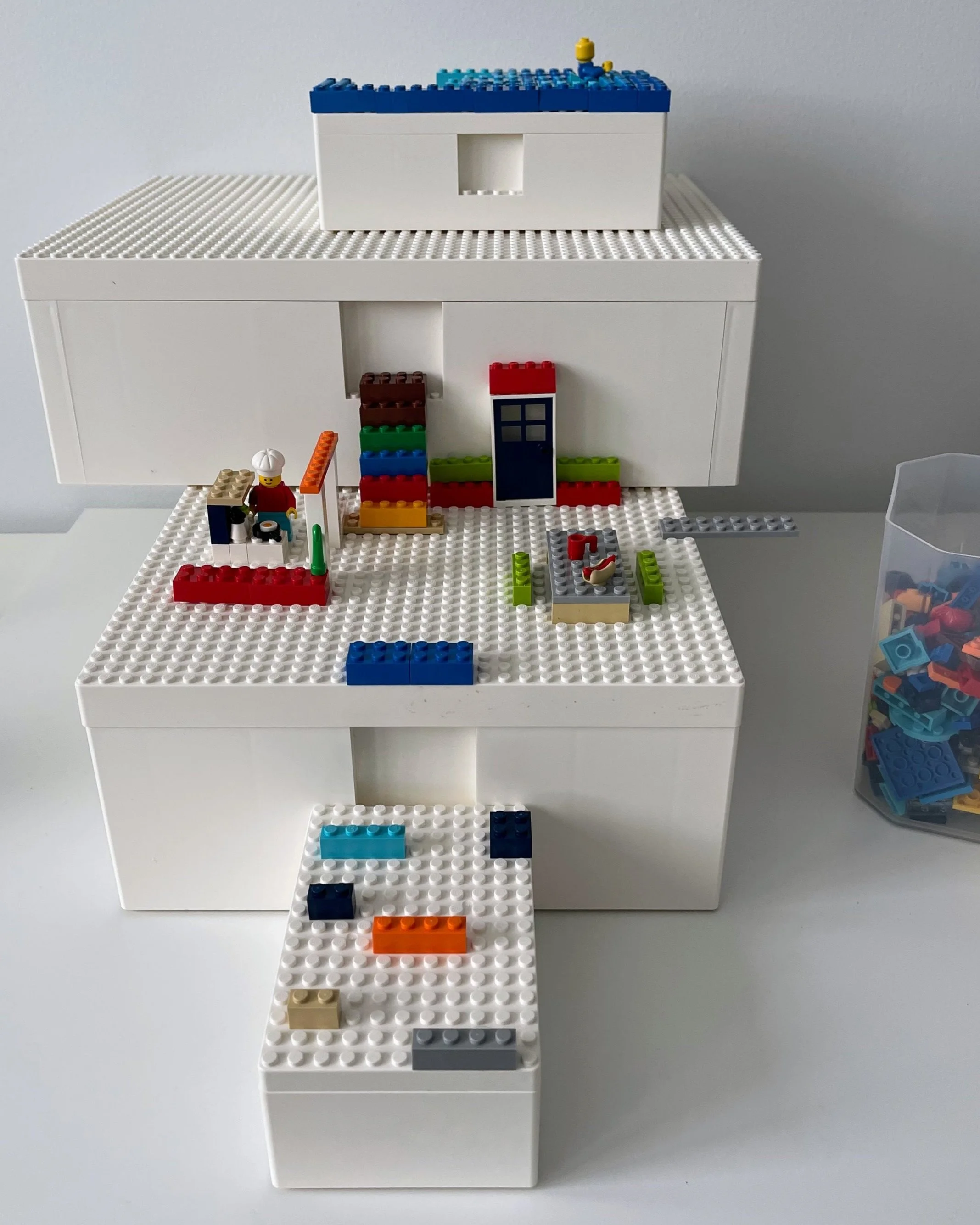 LEGO storage heads, IKEA BYGGLEK boxes, and baseplates add fun storage and play features to the LEGO space.