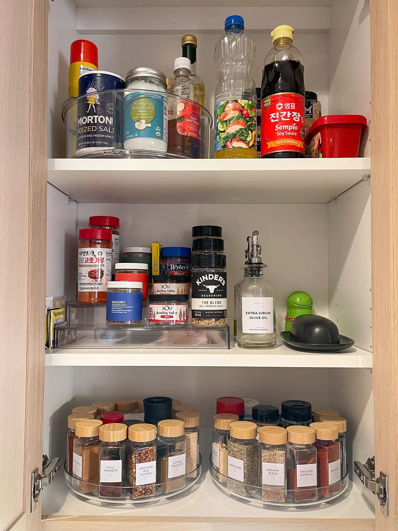 Kitchen cabinet organizing with an easy-access spice rack