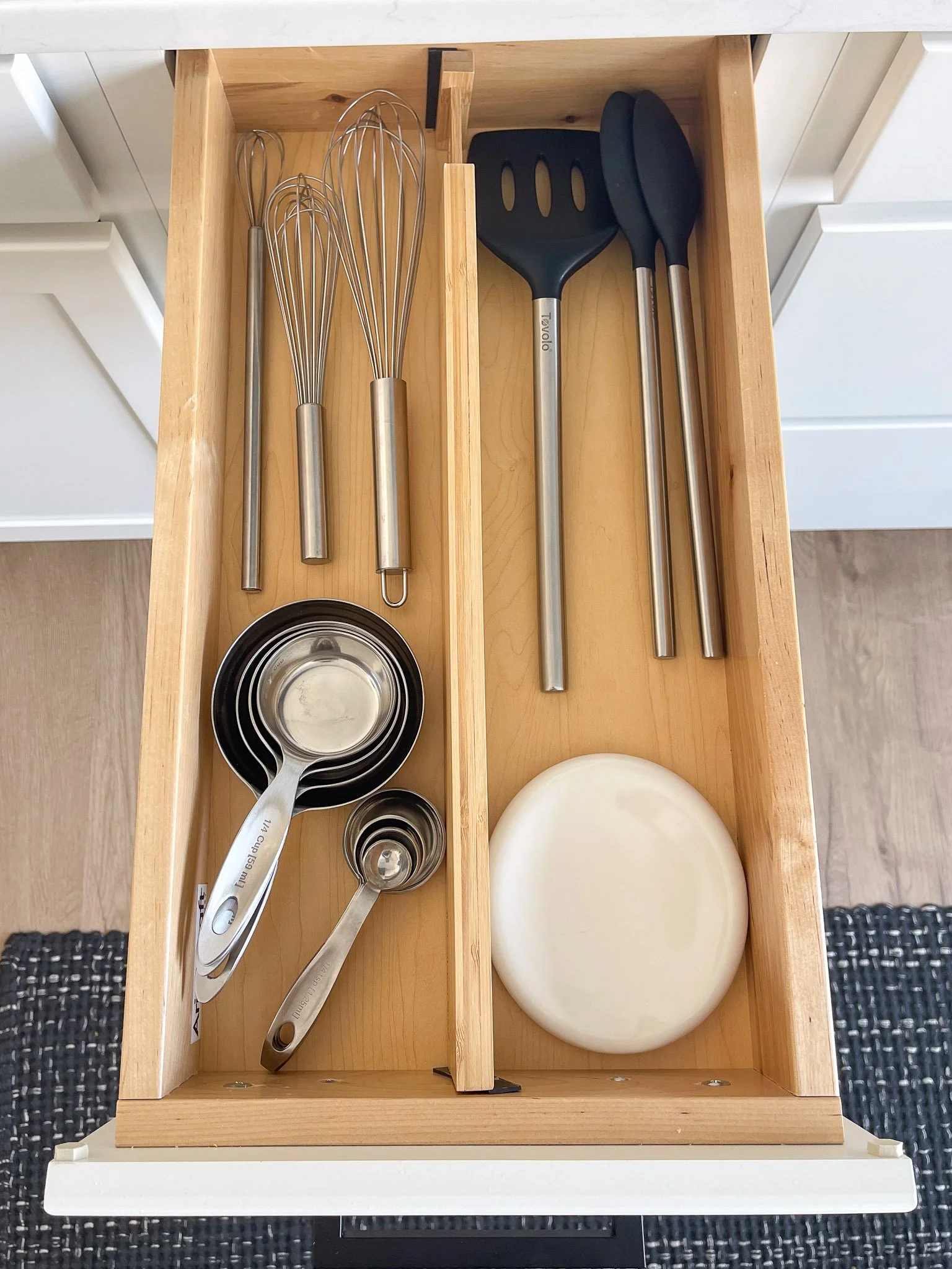 Kitchen utensil drawer organized with custom dividers