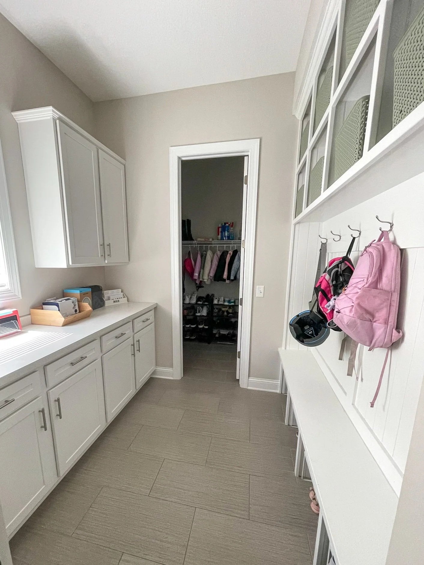 Professionally organized mudroom with customized storage for a busy family.