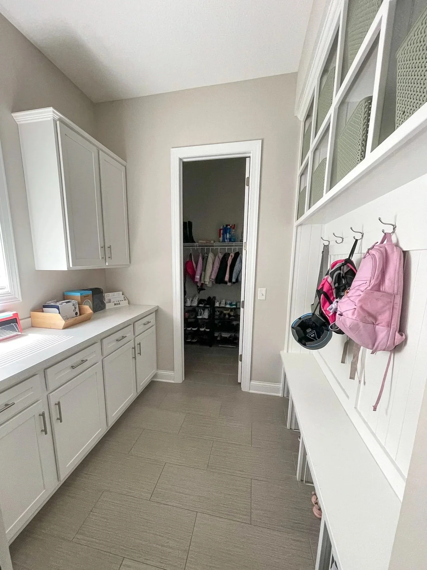 Professionally organized mudroom with customized storage for a busy family.