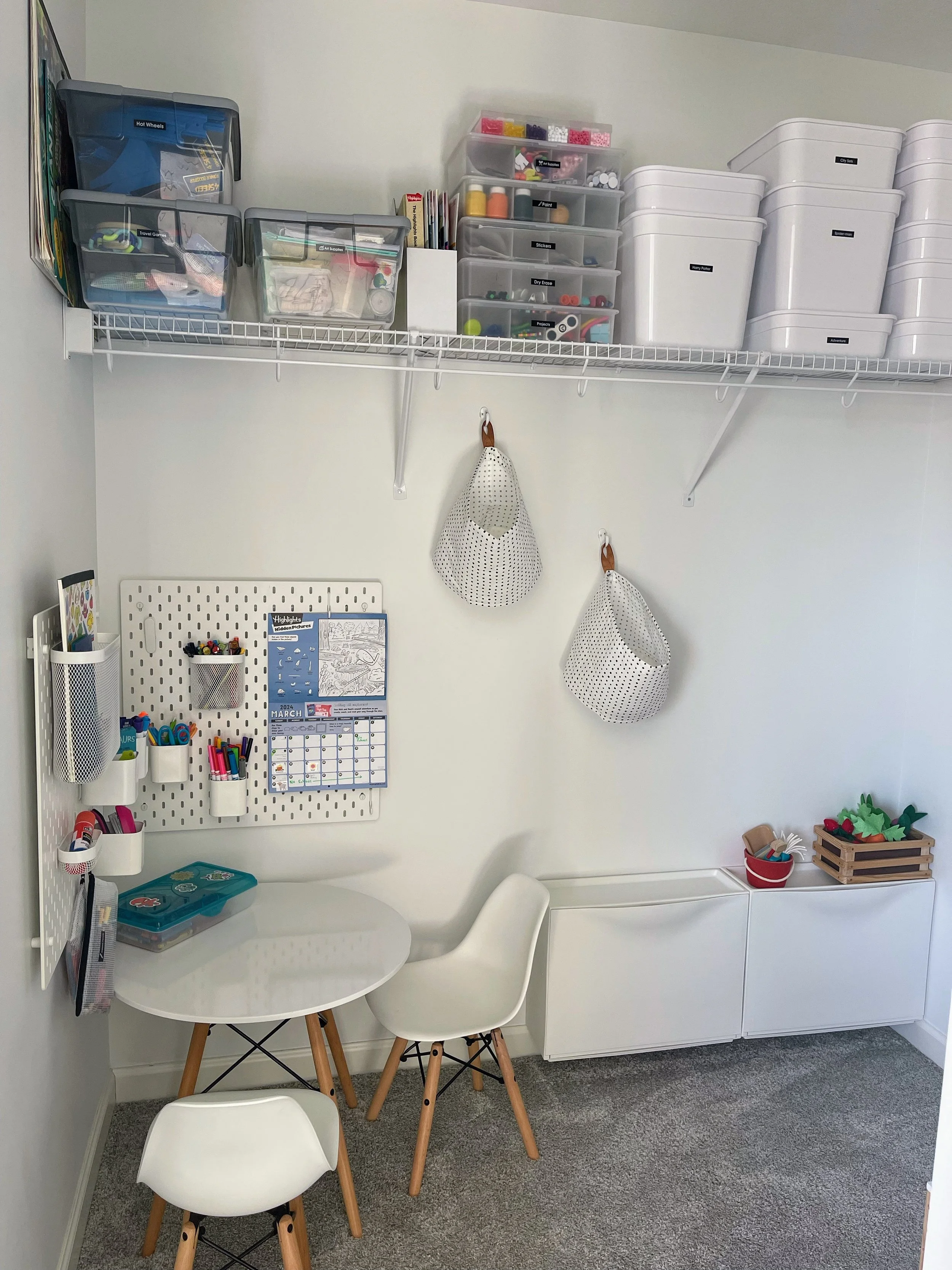 Builder-grade walk-in closet before installing a custom nursery organization system.