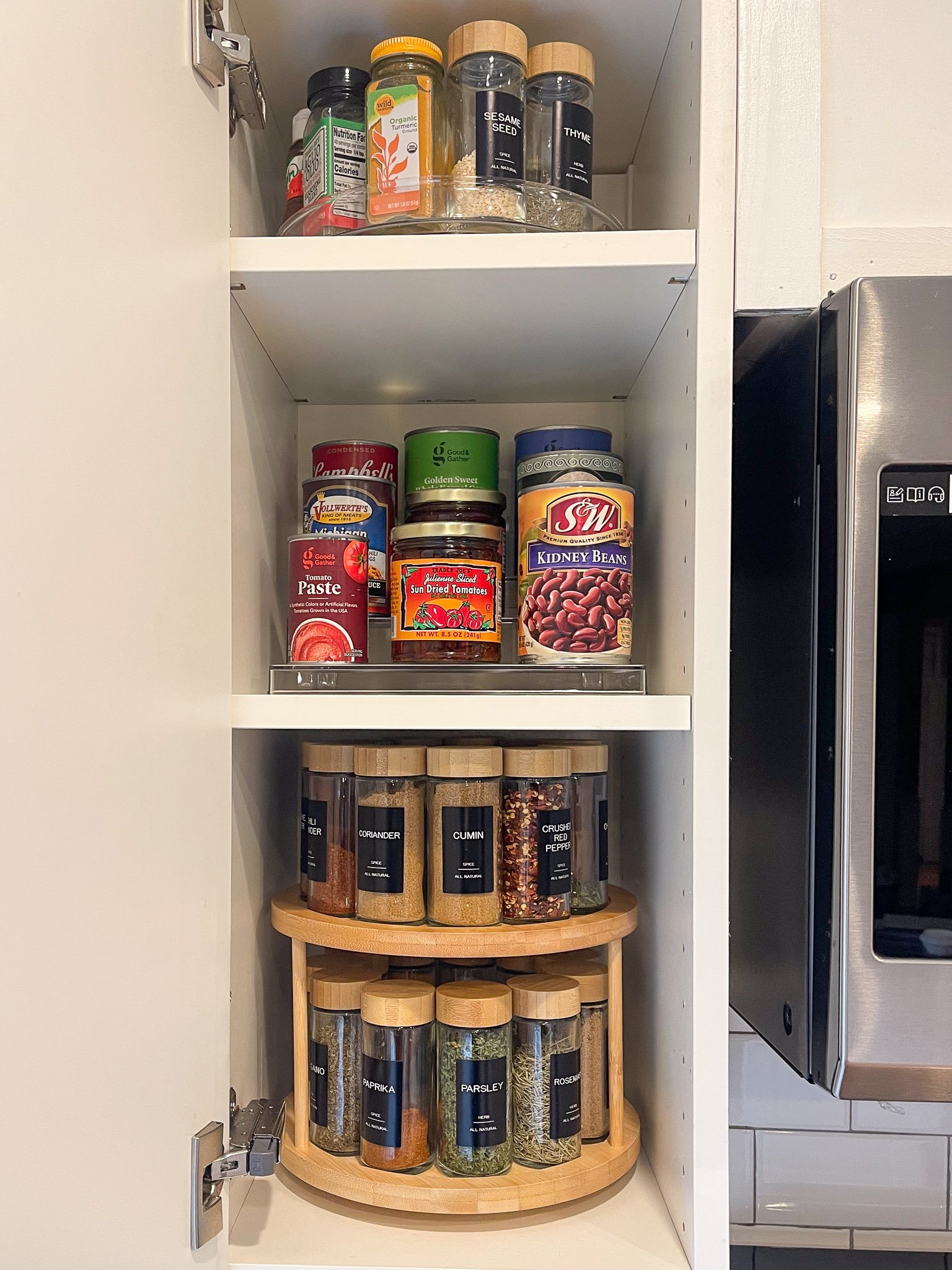 Move-in kitchen cabinet organizing with labeled spice storage