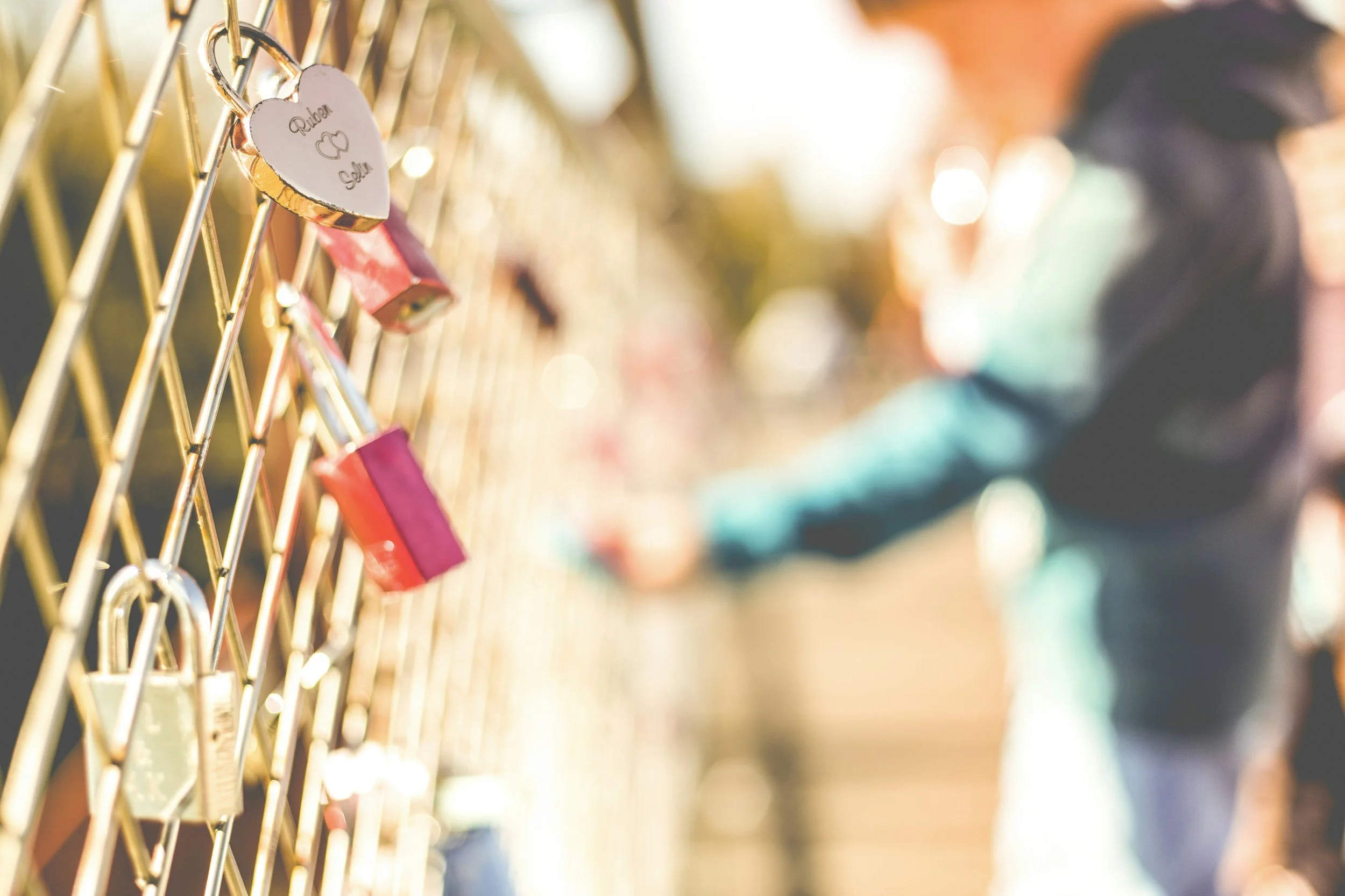Locks on a fence symbolizing emotional connection, attachment, and relationships