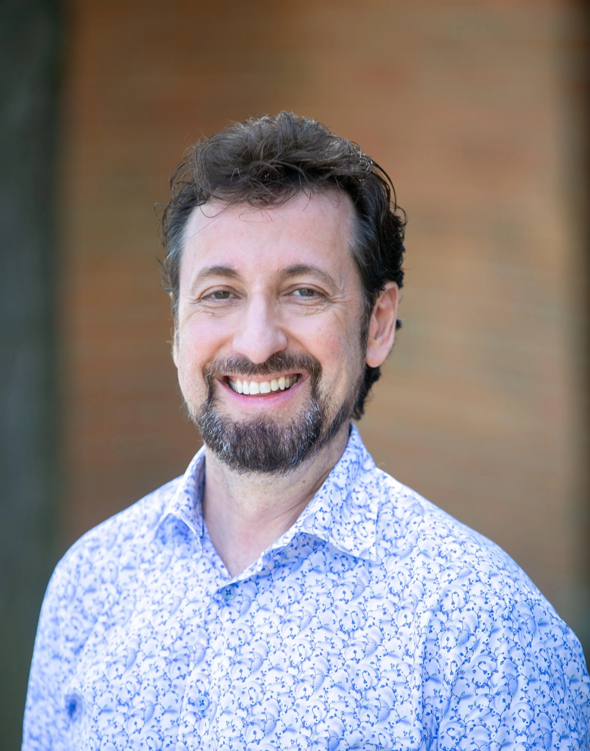 headshot of man smiling