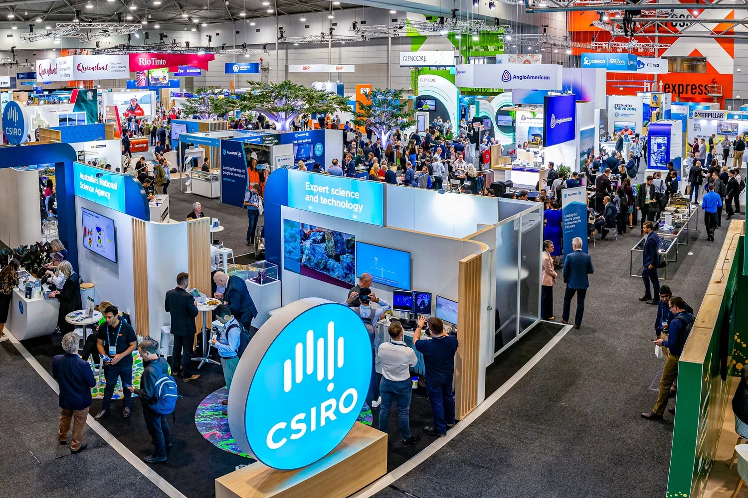 Wide room shot of busy Brisbane trade show and exhibition floor with delegates visiting sponsor and exhibitor stands at BCEC