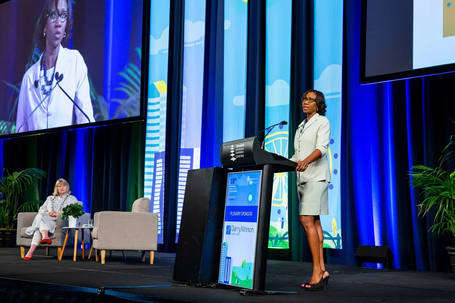 Keynote speaker presenting on stage at a national industry conference at Brisbane Convention & Exhibition Centre