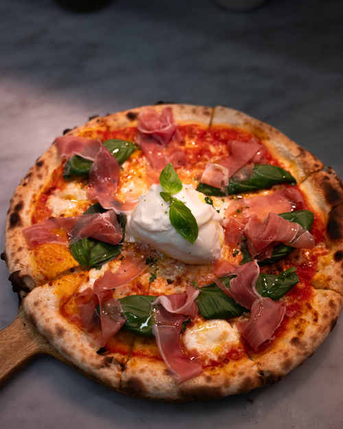 Bufalina Pizza with Mozzarella, Tomato, Prosciutto, and Basil at Fellini Italian Restaurant Hobart