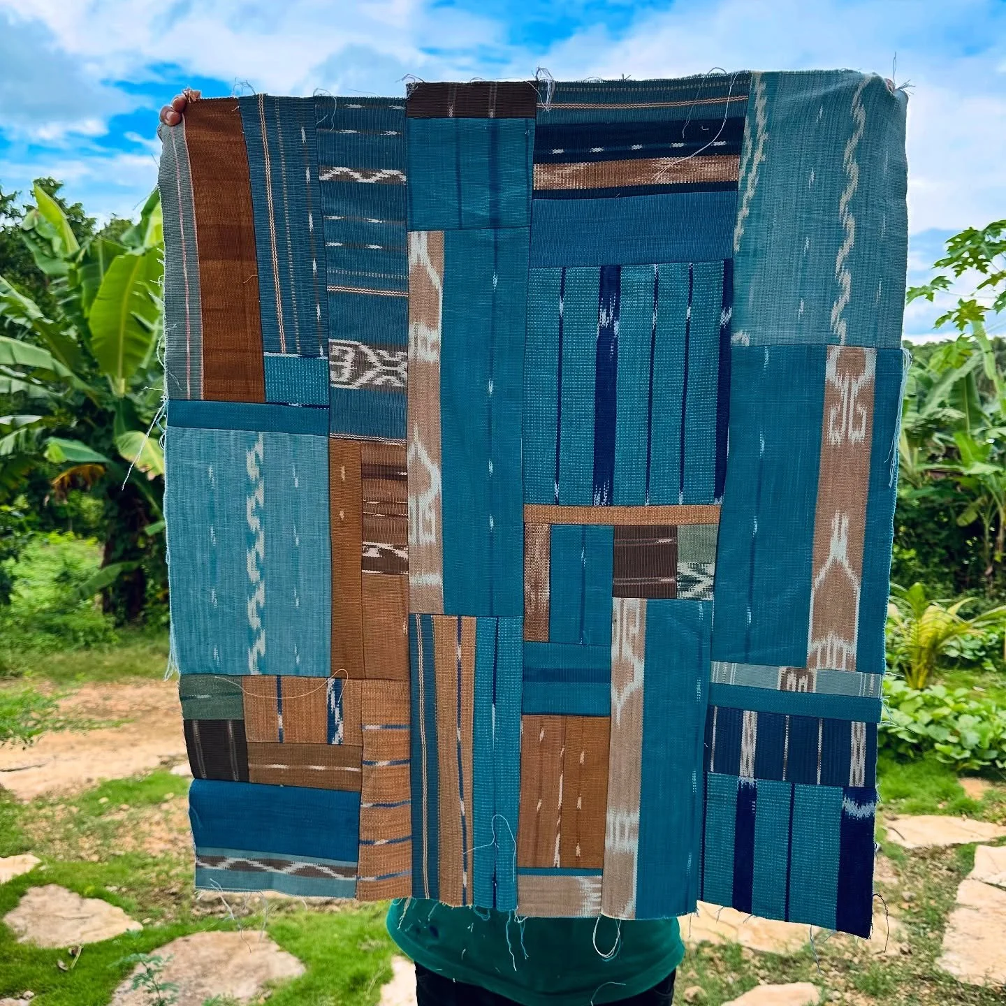 Our signature recrafted ikat honours the months of work our weavers put into each tapesty. The cut offs from our garment and accessories production are 100% reused, either through this traditional patchwork technique, or through our signature zigzag 