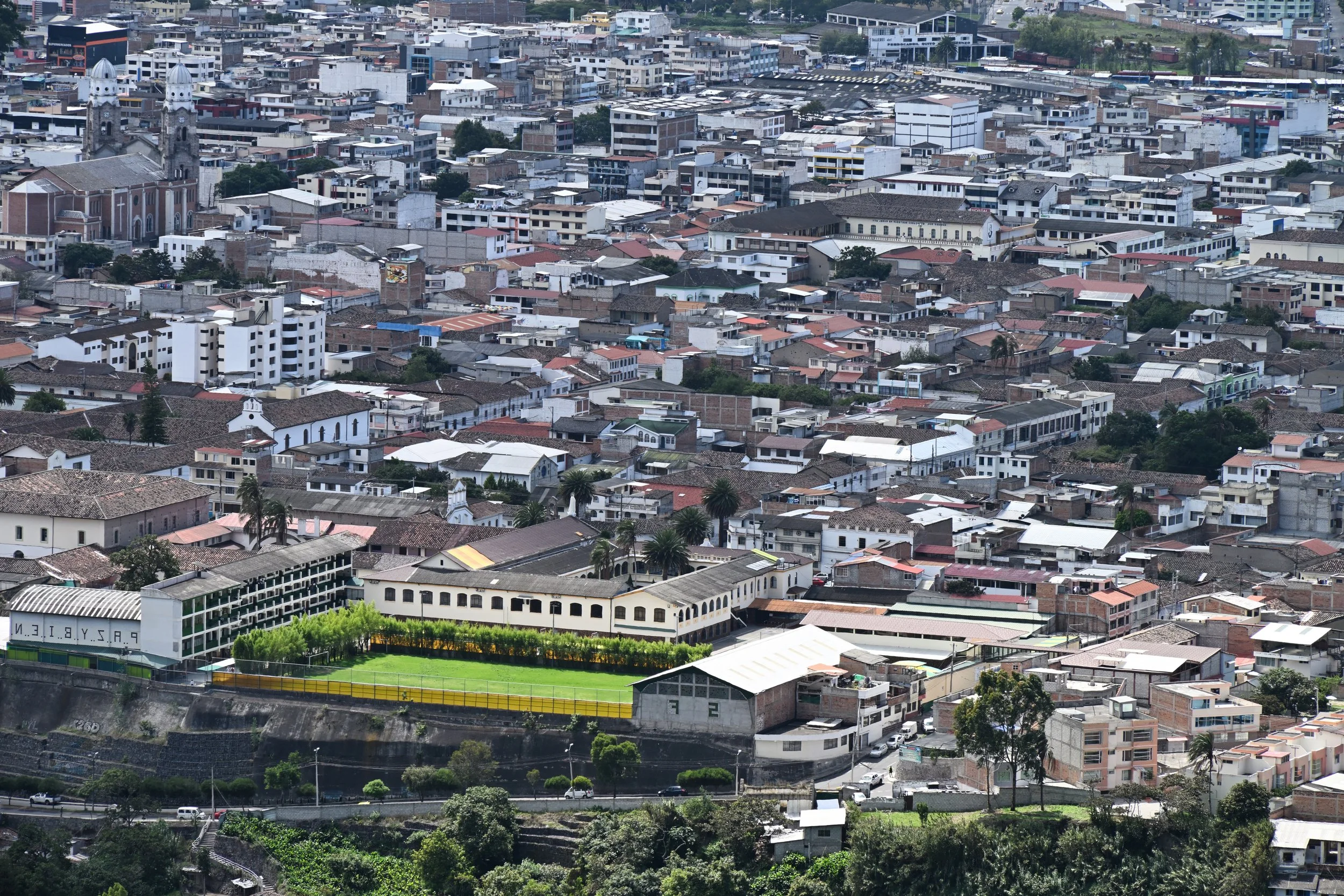 a football field in the middle of the town