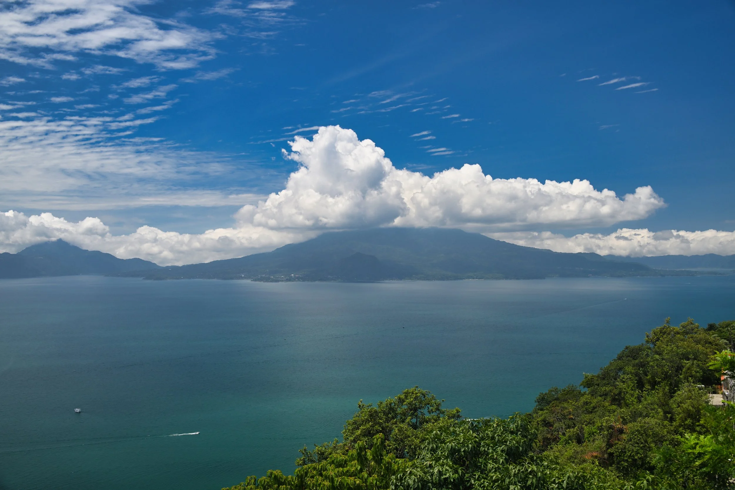 lake surrounded by volcanos