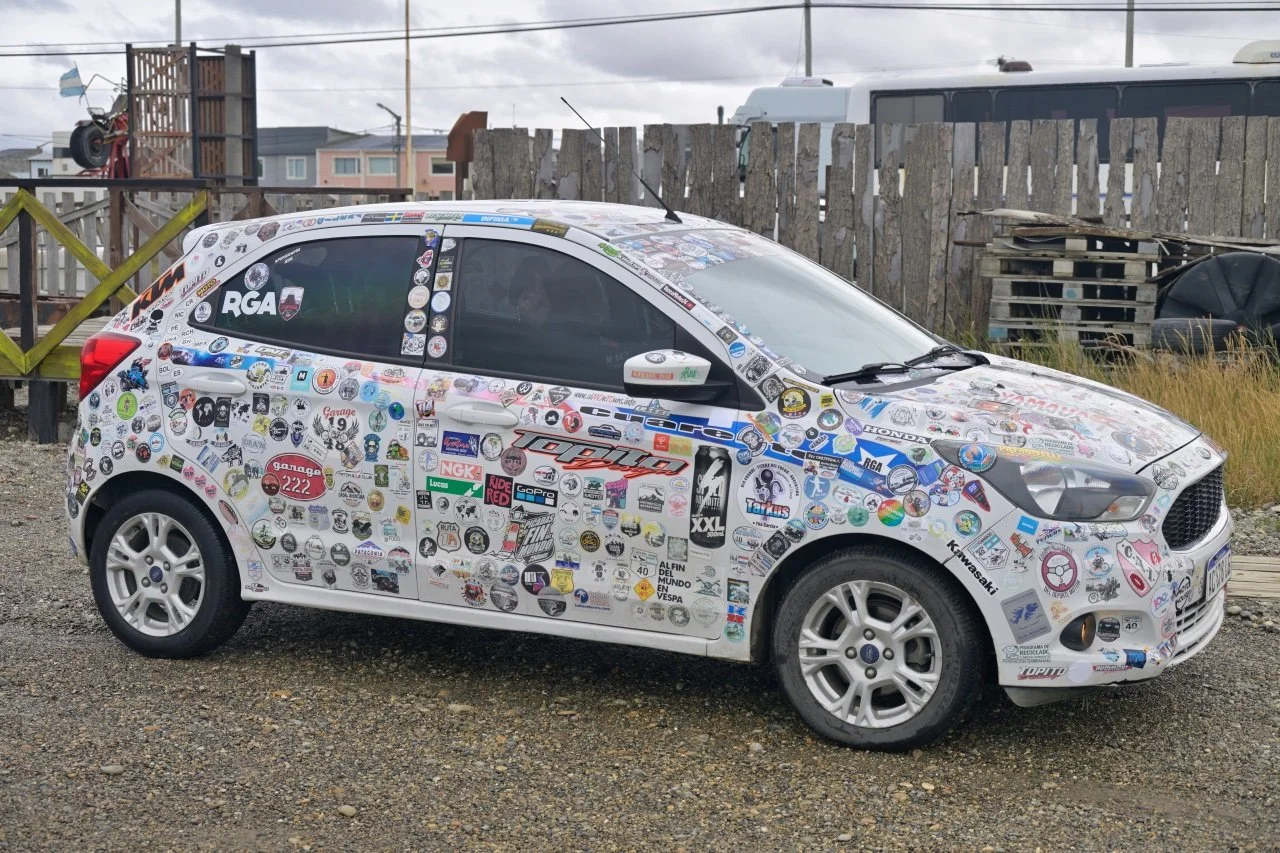 one of the member has his entire car decorated with stickers of passing bikers