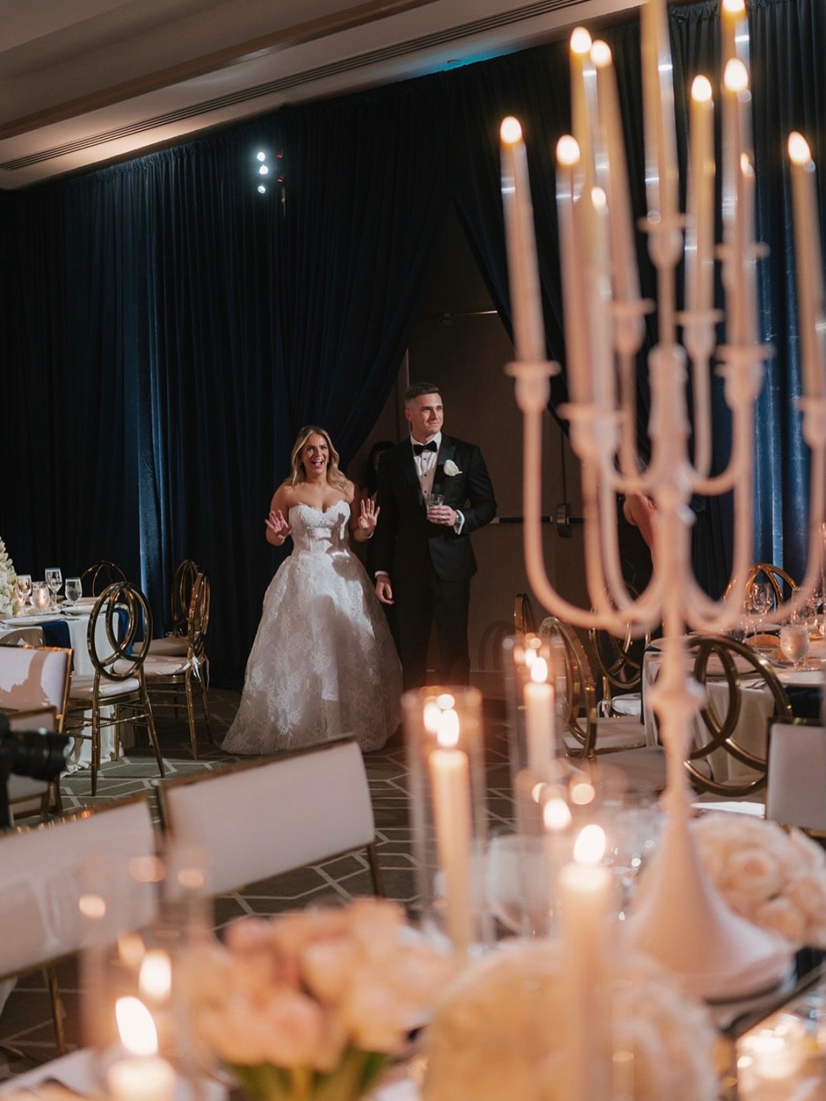 Rachel and Tyler&rsquo;s wedding at the Four Seasons was a ballroom reveal for the books. Navy velvet drapes, mirrored elements and glimmers of silver and gold transformed the space into a stunning vision of timeless romance, illuminated by the glow 