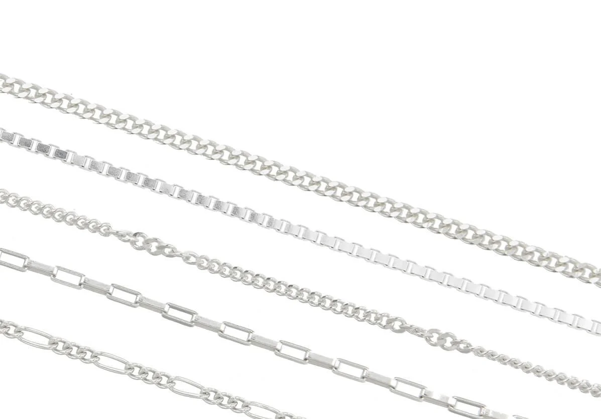 Six silver chains arranged diagonally on a white background, featuring different link styles and sizes.