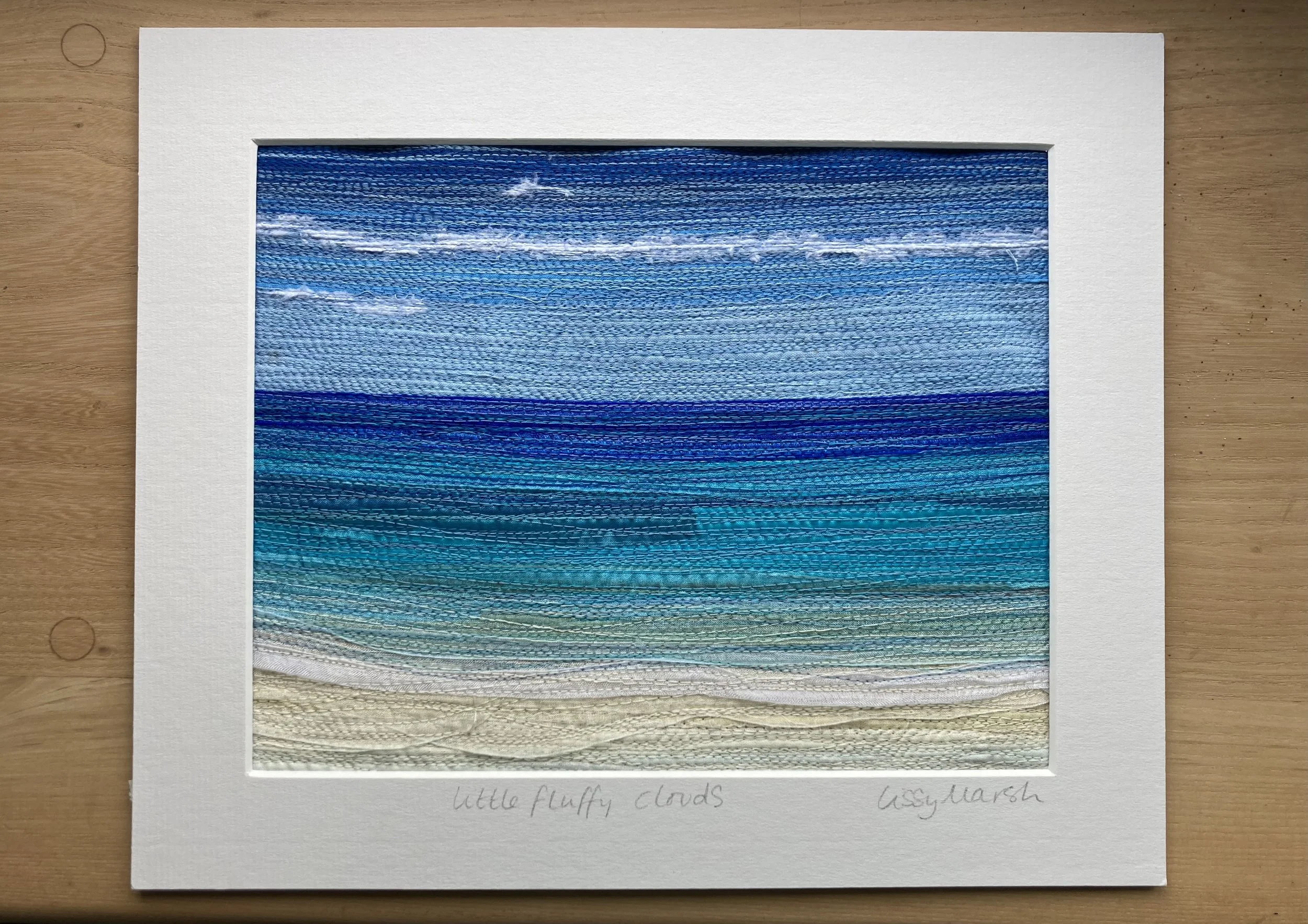 Fluffy clouds textile art