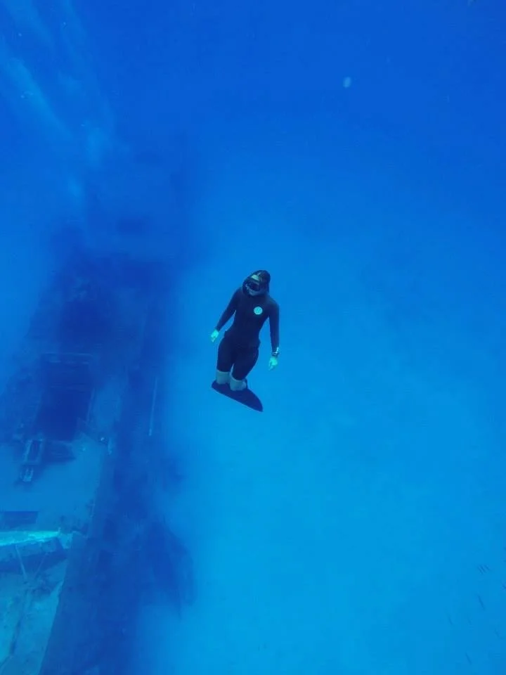 Lissy marsh freediving with a monofin at the P31 shipwreck in Malta