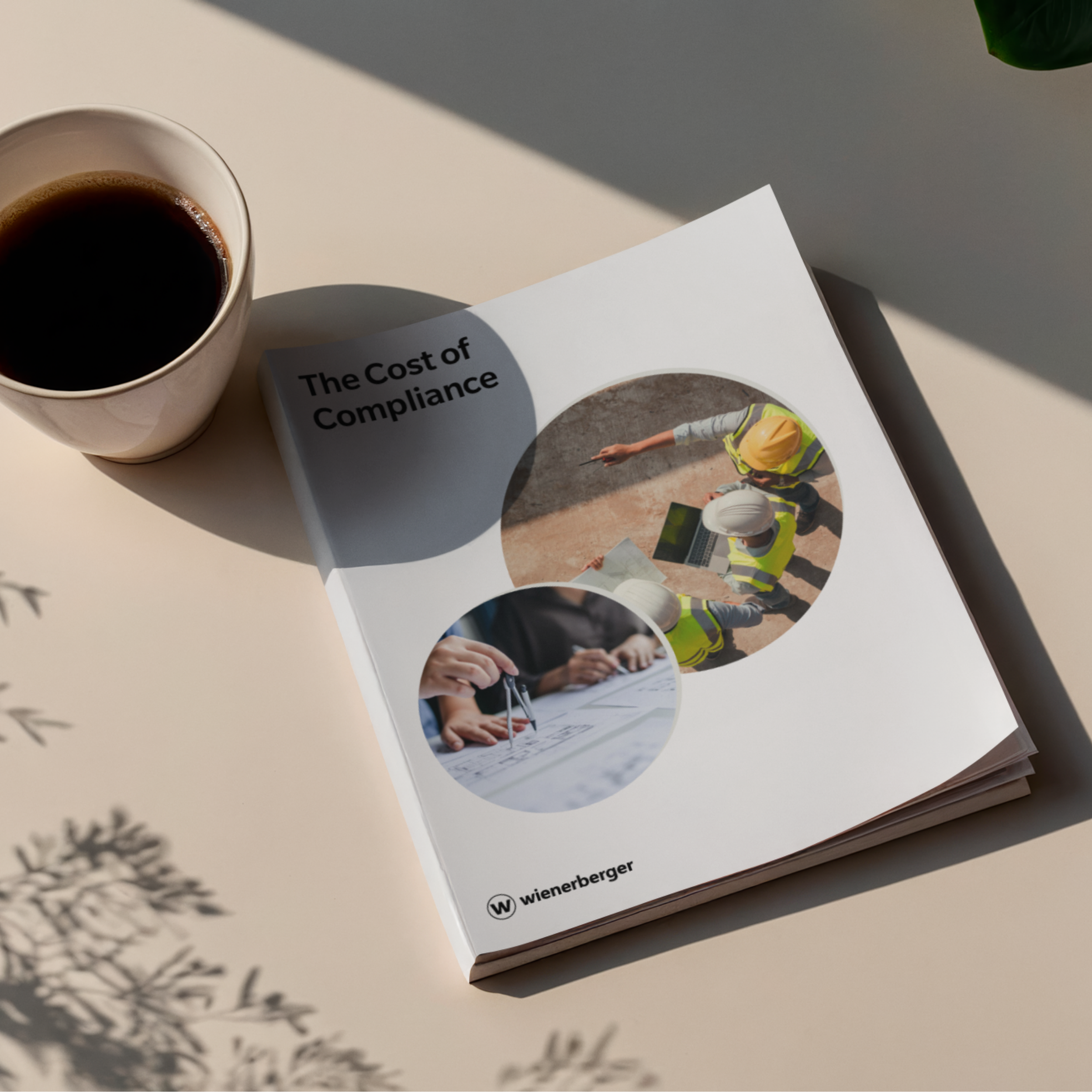 A flatlay of a whitepaper report titled "The Cost of Compliance" with a coffee mug