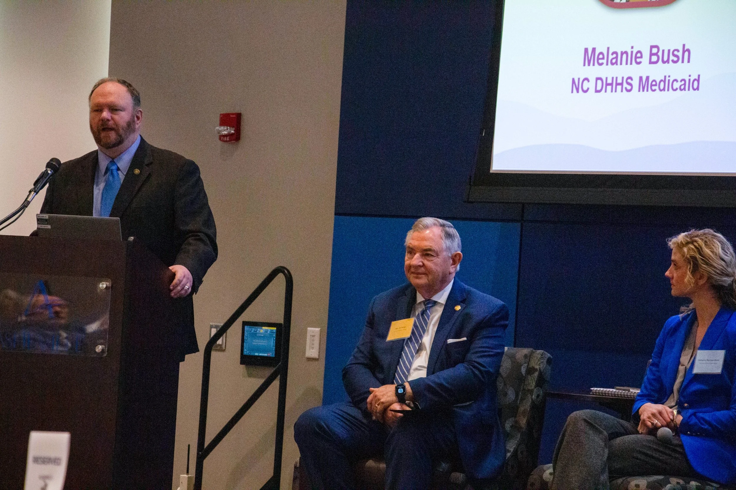 Sen. Ralph Hise (NCGA), panel moderator. Panelists: Sen. Jim Burgin (NCGA) and Katherine Martin(VP of Health Affairs for the UNC System). Photo credit: Michaela Lumpert, Impact Health. 