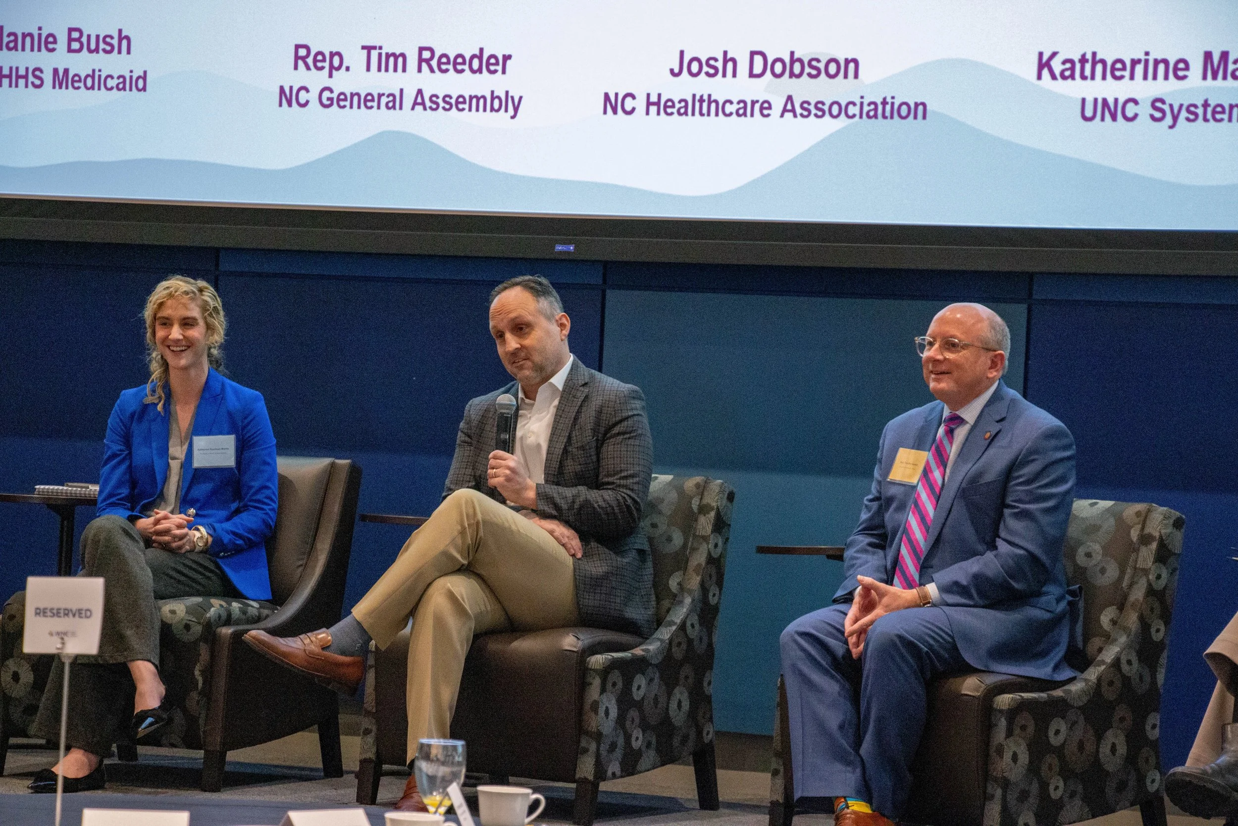 Panelists: Katherine Martin (VP of Health Affairs for the UNC System) Josh Dobson (President and CEO of the NC Healthcare Association), and Rep. Tim Reeder (NCGA). Photo credit: Michaela Lumpert, Impact Health. 