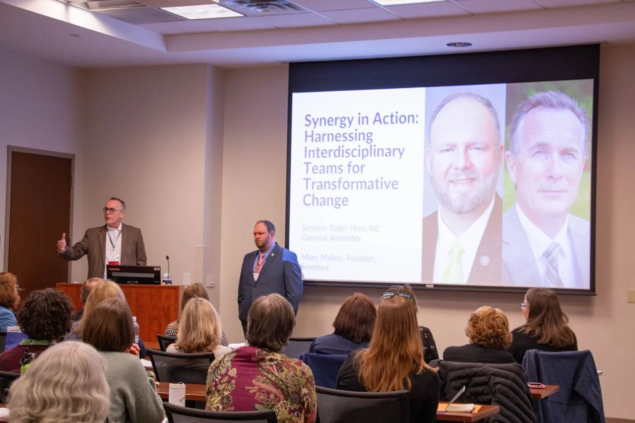 Marc Malloy (Sevenya, LLC and PCP4ME) and Sen. Ralph Hise (NC General Assembly, 47th District) speak about the shared history of the WNC HPI and Impact Health during the event’s opening session.