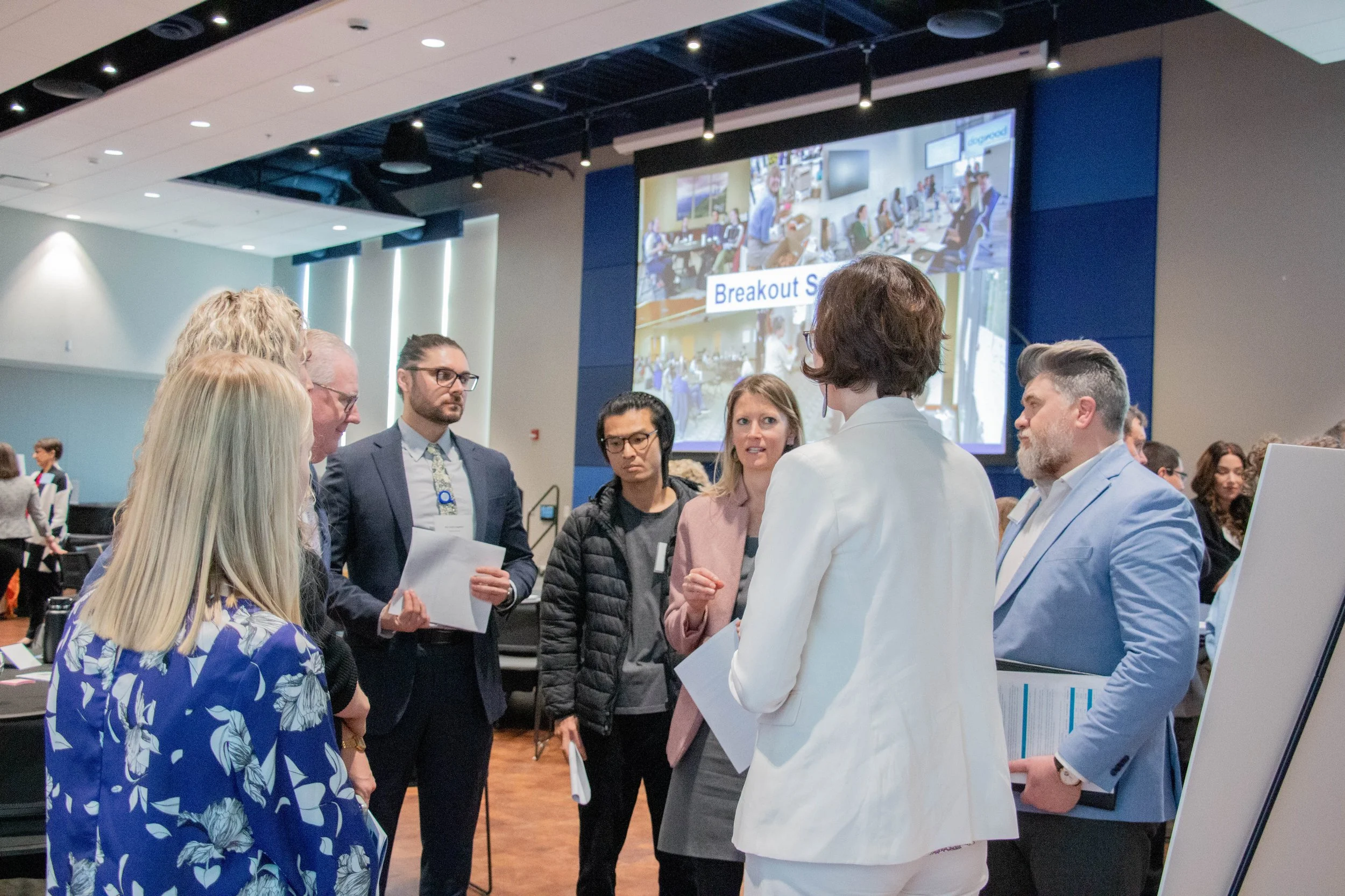 Attendees listening to regional health policy researchers a breakout session. Photo credit: Michaela Lumpert, Impact Health