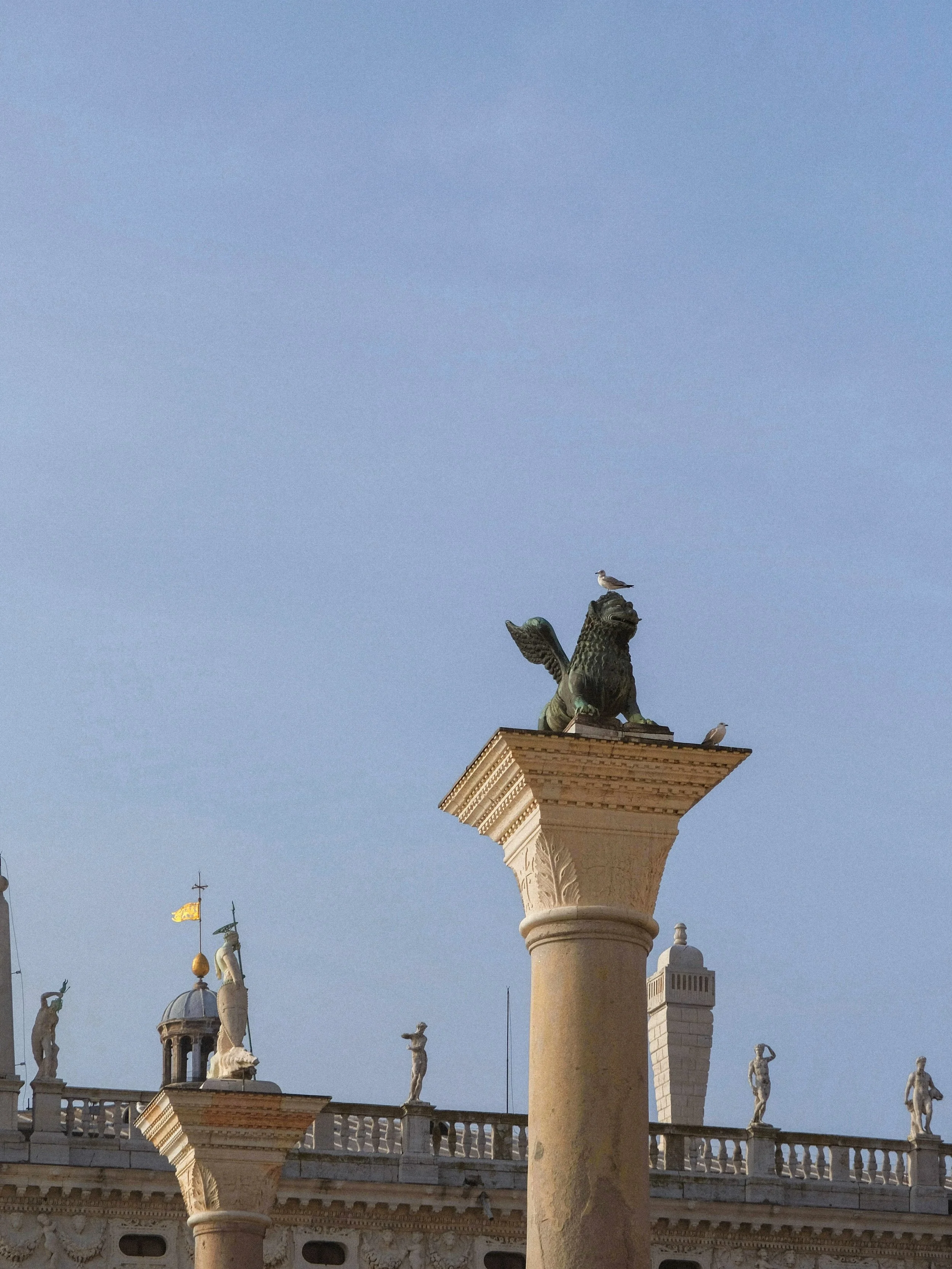 iconic symbols of Venice: the Column of San Marco (bearing the winged lion) and the Column of San Teodoro (topped by the city&rsquo;s first patron saint). 

it is considered bad luck to walk between the two 🦁🪽
.
.
.
.
.
.
.
.
.
.
.
.
#venicephotogr