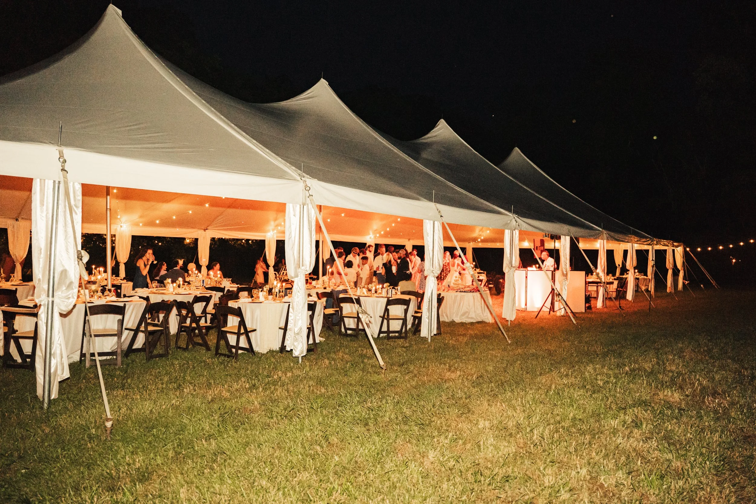 Large tent setup in a large field in Nashville, TN for a wedding.