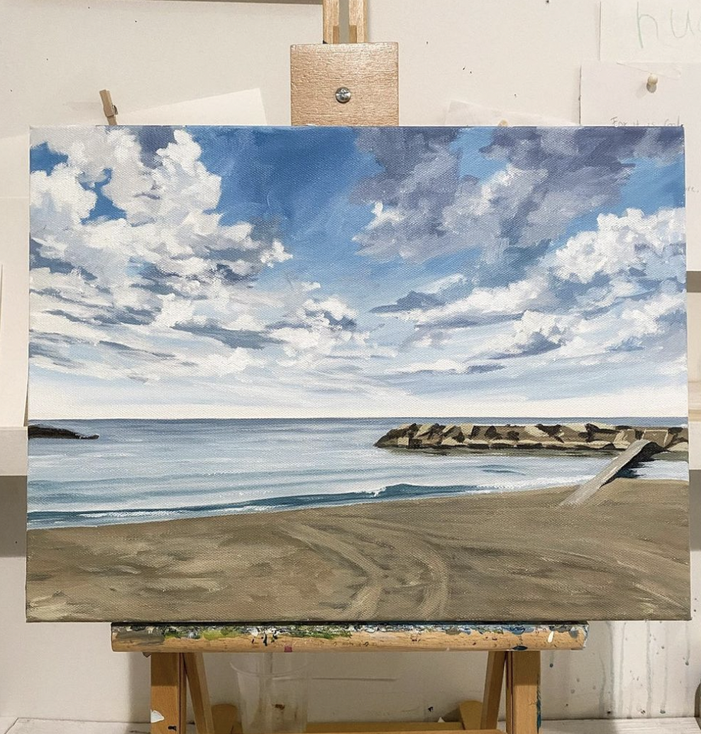 A realistic painting of a beach scene with sandy shore, calm ocean water, and a partly cloudy sky.