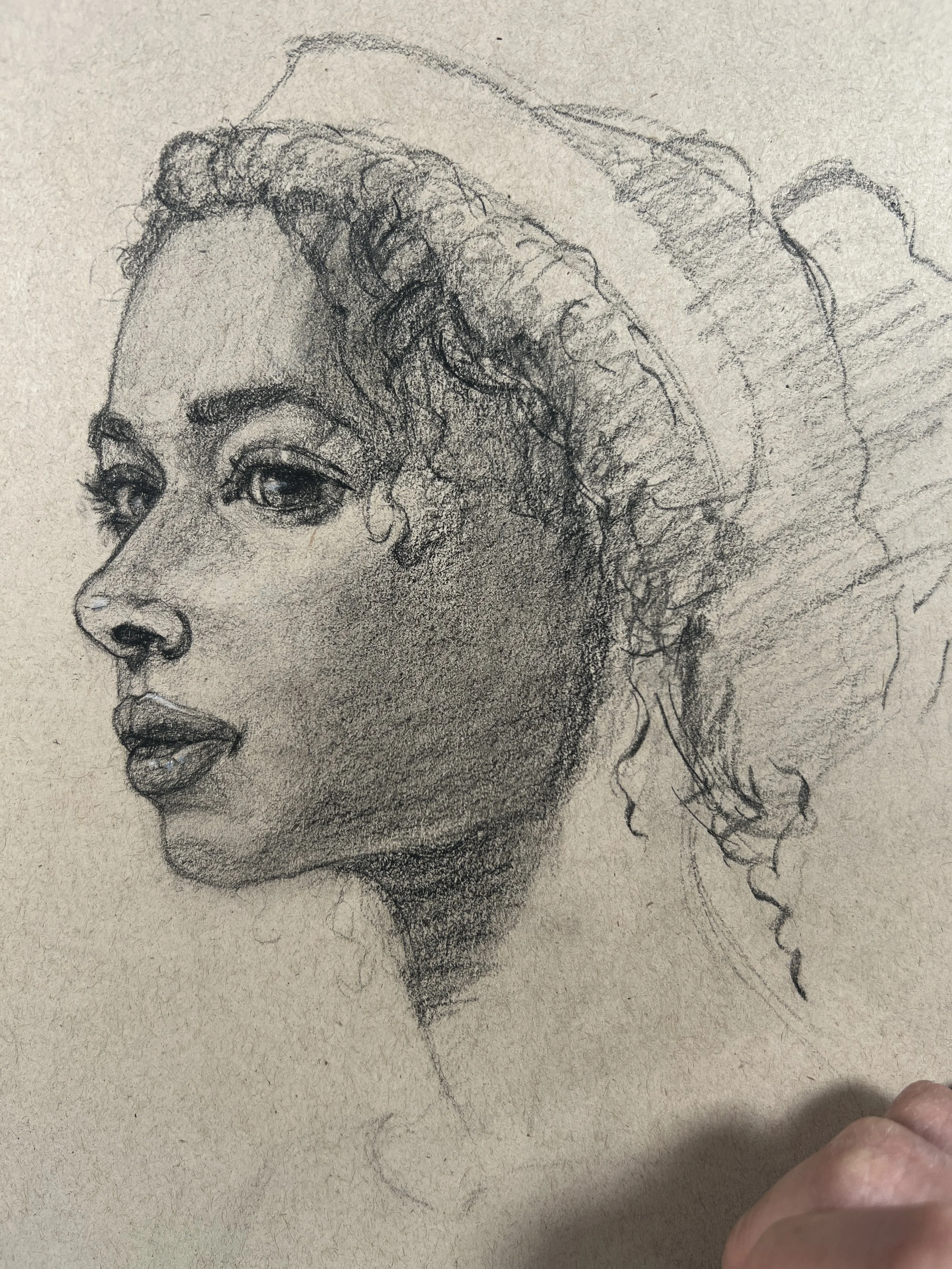 A detailed pencil sketch of a woman in profile with curly hair and a headpiece.