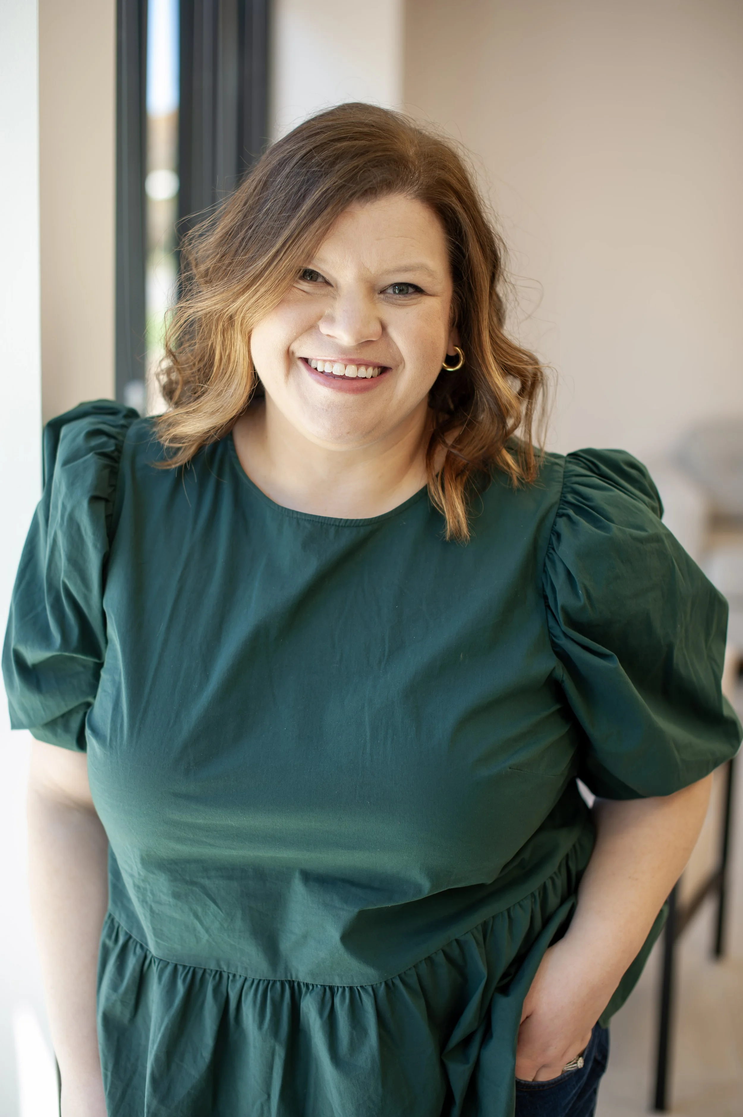 an image of Meghan Thomas smiling at the camera