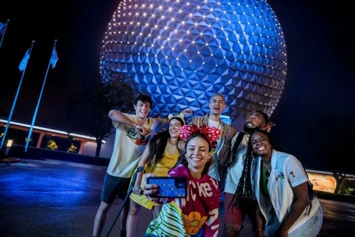Friends taking pictures at Epcot Ball after hours