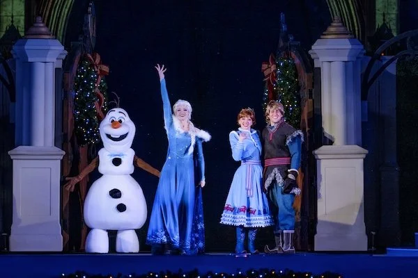 Olaf, Anna, Elsa and Kristoff from Disney's Frozen on stage at Magic Kingdom for Christmas holidays