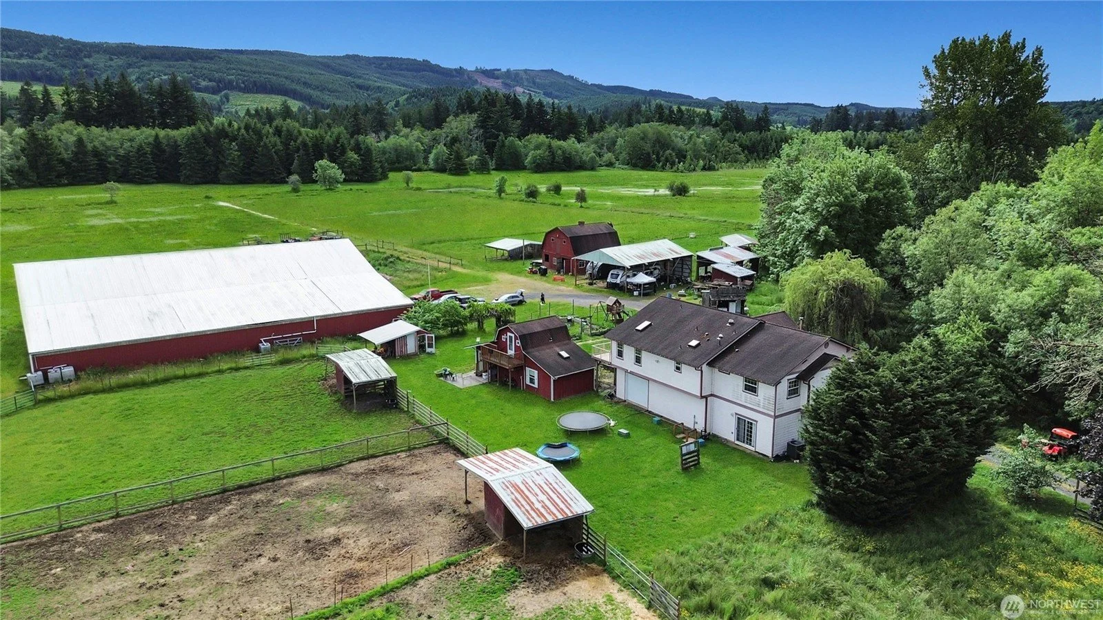 Aerial photo of an equestrian property in Lewis County Washington. Shows barn, arena, home and pasture.
