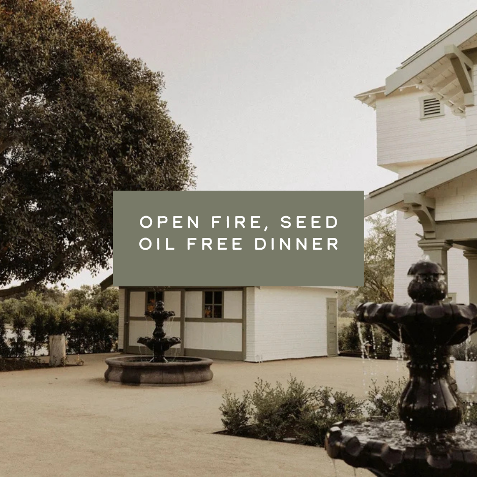 2 WATERFOUNTAINS NEAR WHITE FARM HOUSES WITH THE TEXT READING "OPEN FIRE SEED OIL FREE DINNER"