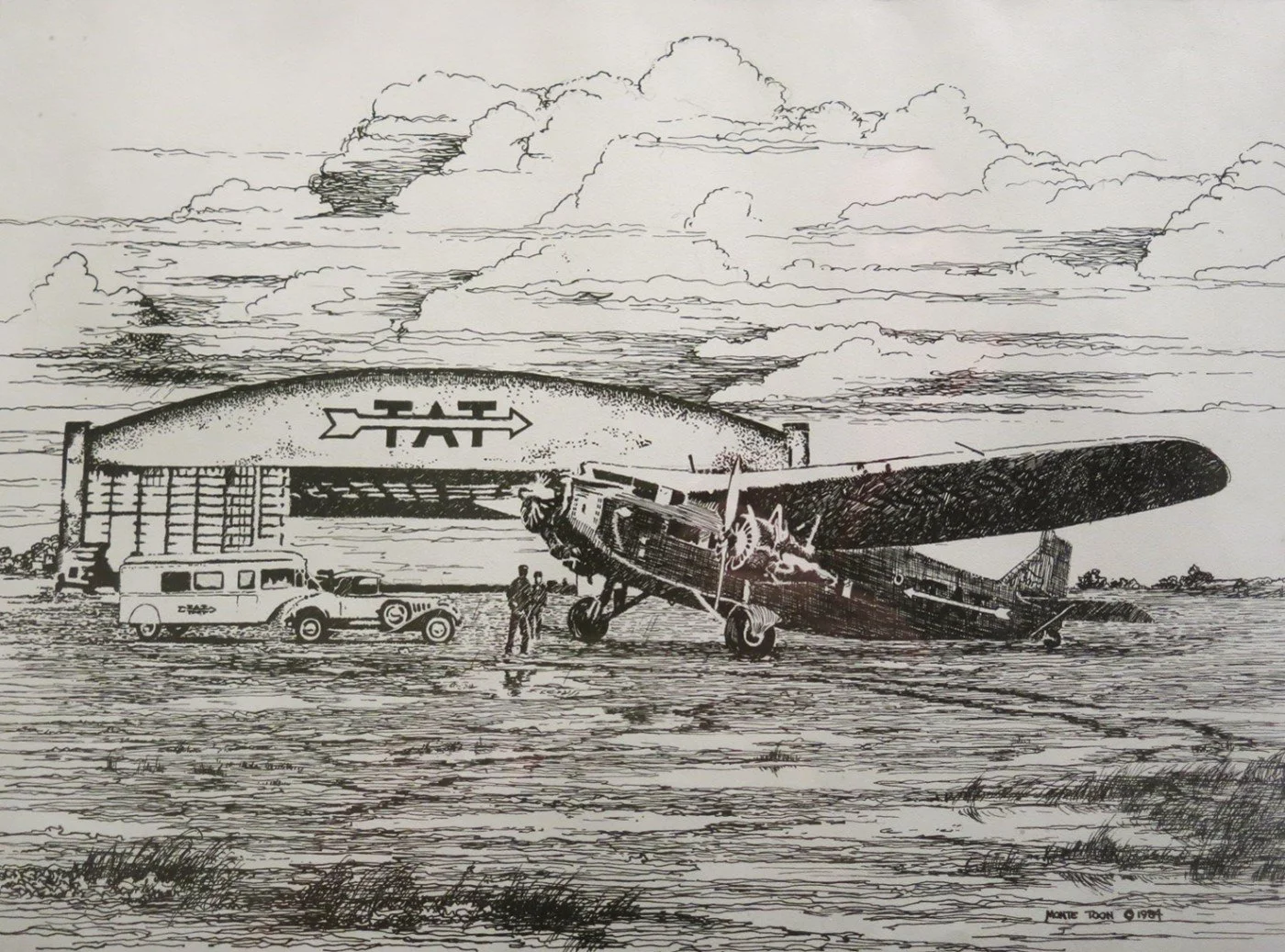A vintage airplane parked on an airfield with two people standing nearby, with an aircraft hangar in the background and a few cars parked next to the plane, under a sky with detailed clouds.