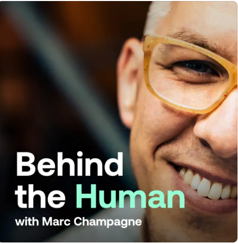 Cover image for the podcast "Behind the Human with Marc Champagne," featuring a close-up of a smiling person wearing glasses.