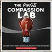 Coca-Cola Compassion Lab logo with a lightbulb design