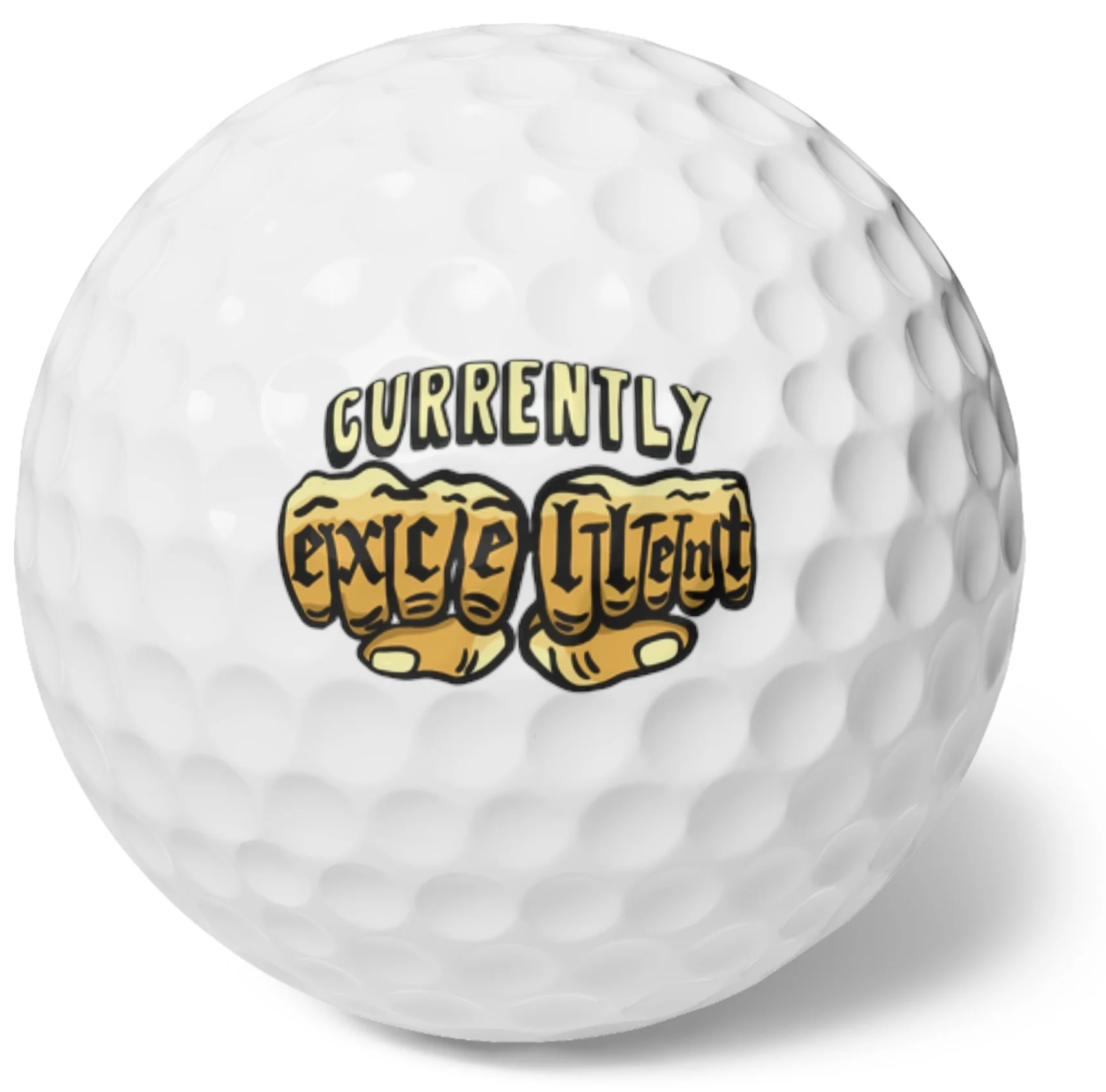 Close-up of a golf ball with a sticker that reads 'Currently Excited' with images of two clenched fists.