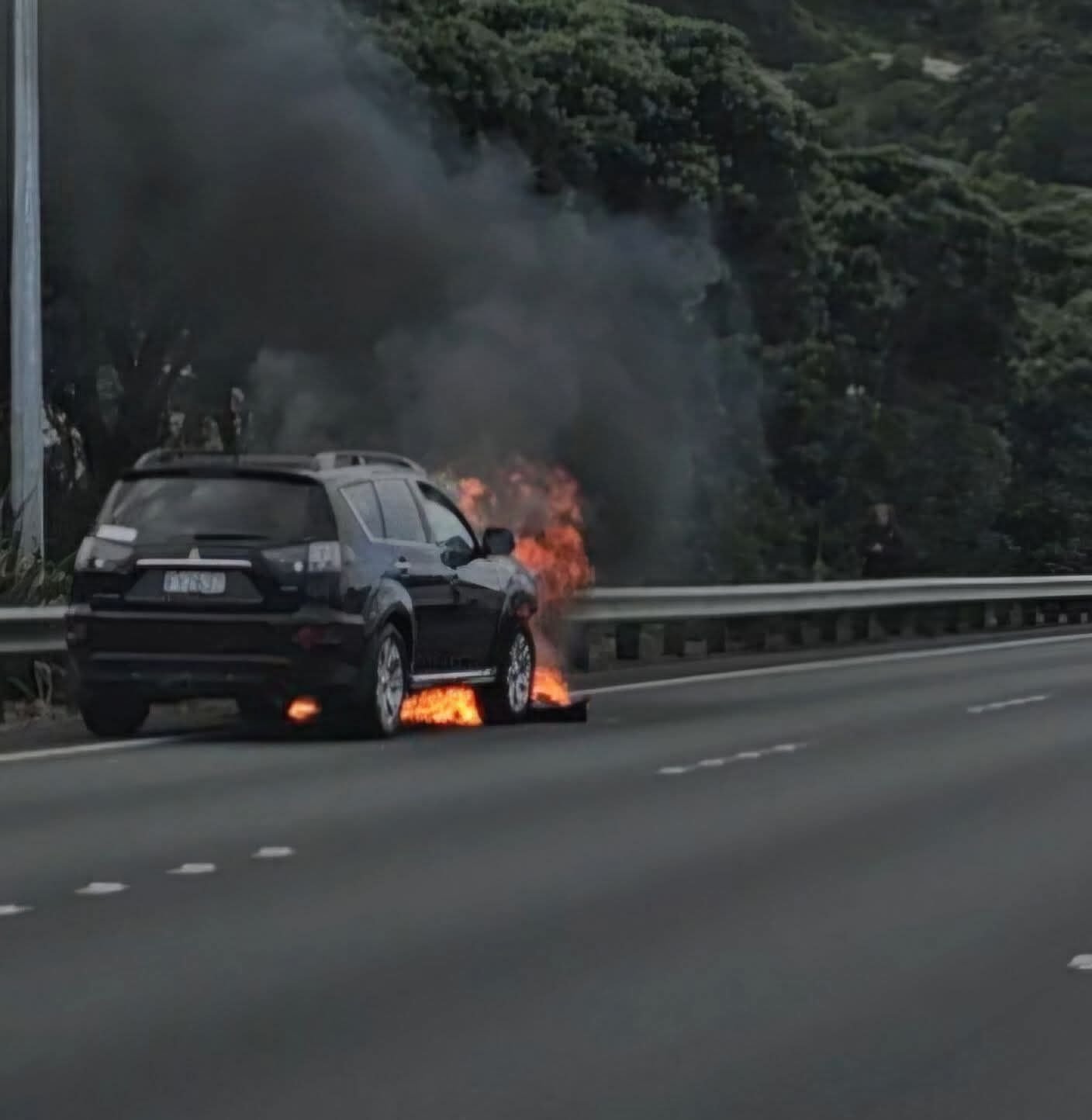 A Mitsi burns on the Urban Motorway in Wellington on Thursday 23 April, 2026. All occupants were ok