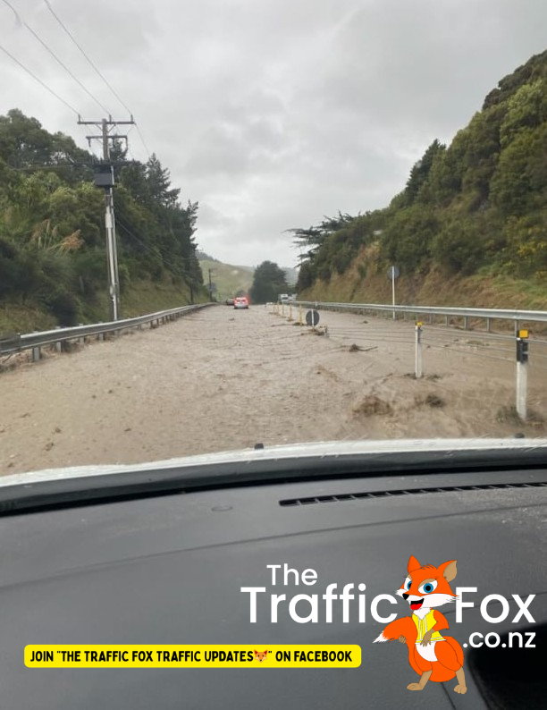 SH58 Haywards Hill with lots of rocks and debris on the road underwater