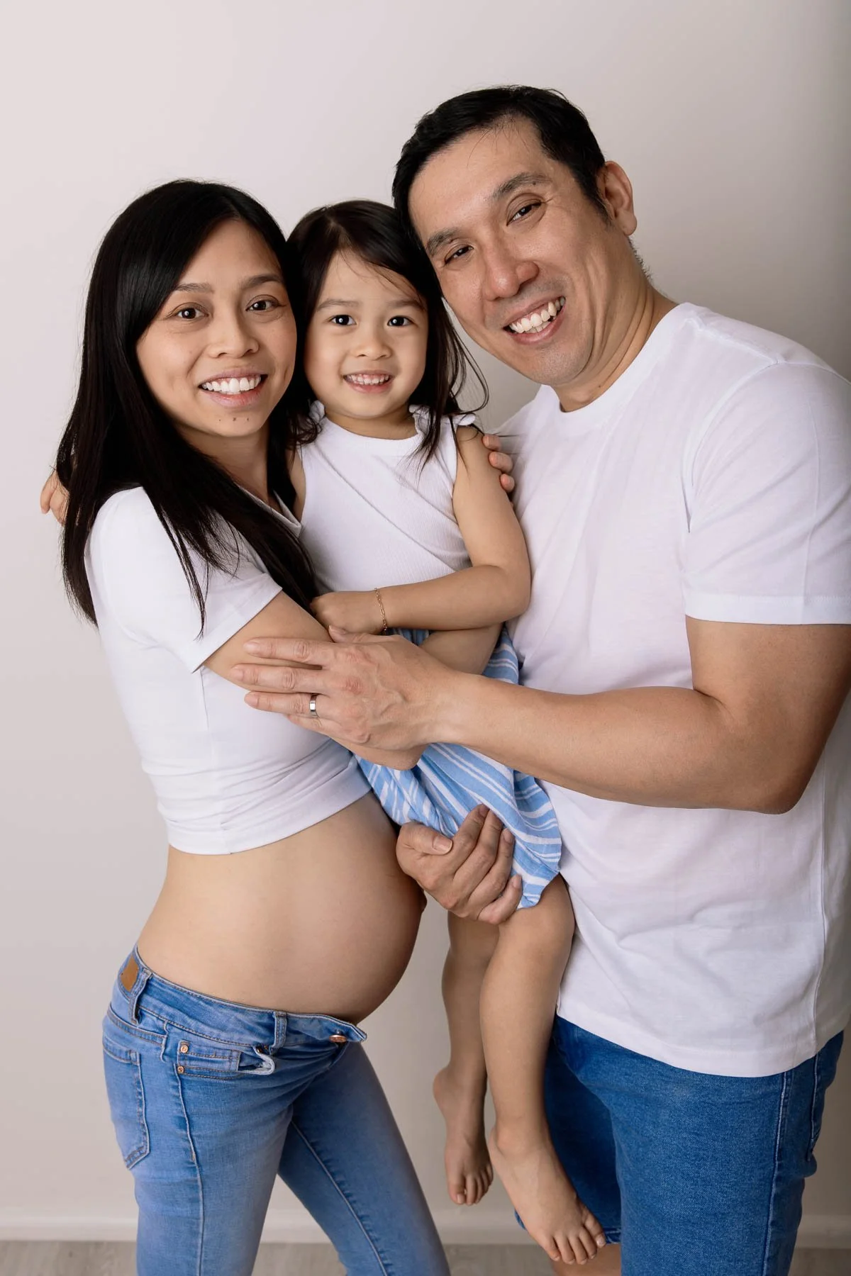 casual family maternity photography including toddlers in studio